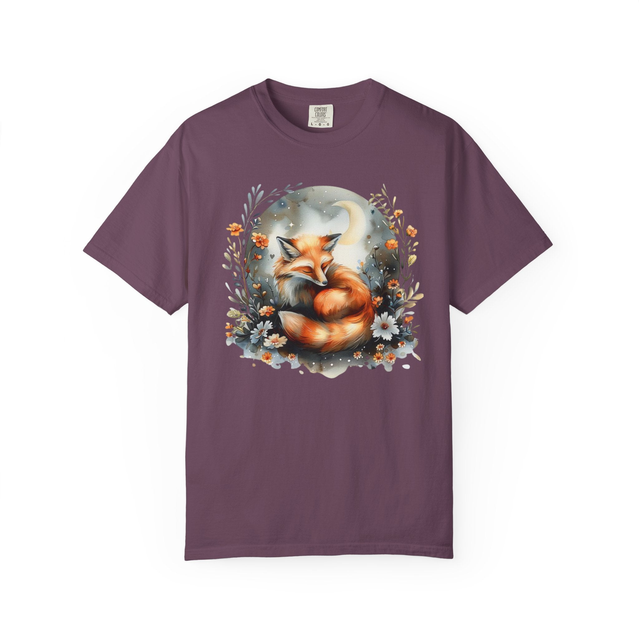 Sleeping fox surrounded by flowers and a crescent moon — cozy cottagecore forestcore design on soft Comfort Colors shirt.