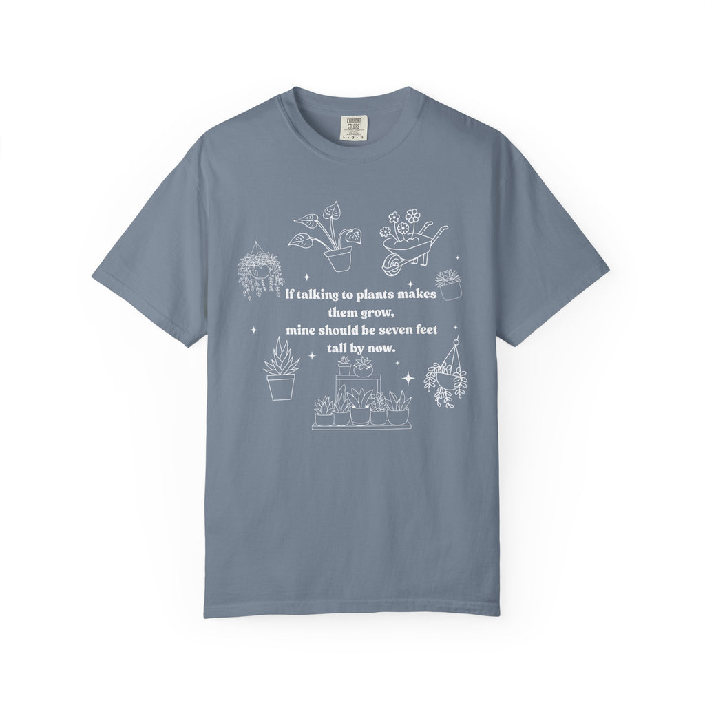Funny plant lover shirt design with white line-art plants and text “If talking to plants makes them grow, mine should be seven feet tall by now.”