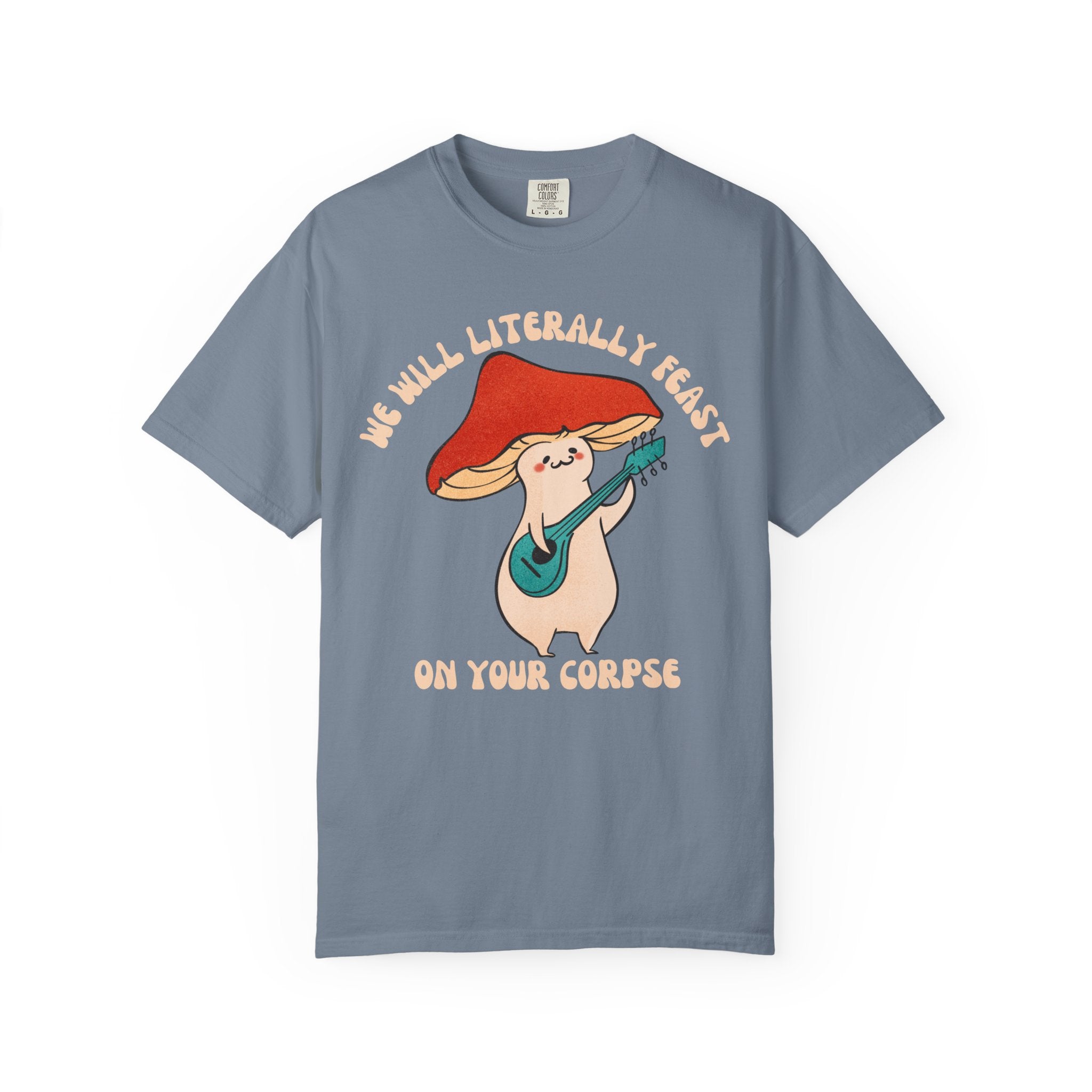 Cute cartoon mushroom playing guitar under a red cap with the quote “We Will Literally Feast on Your Corpse,” printed on a Comfort Colors tee.