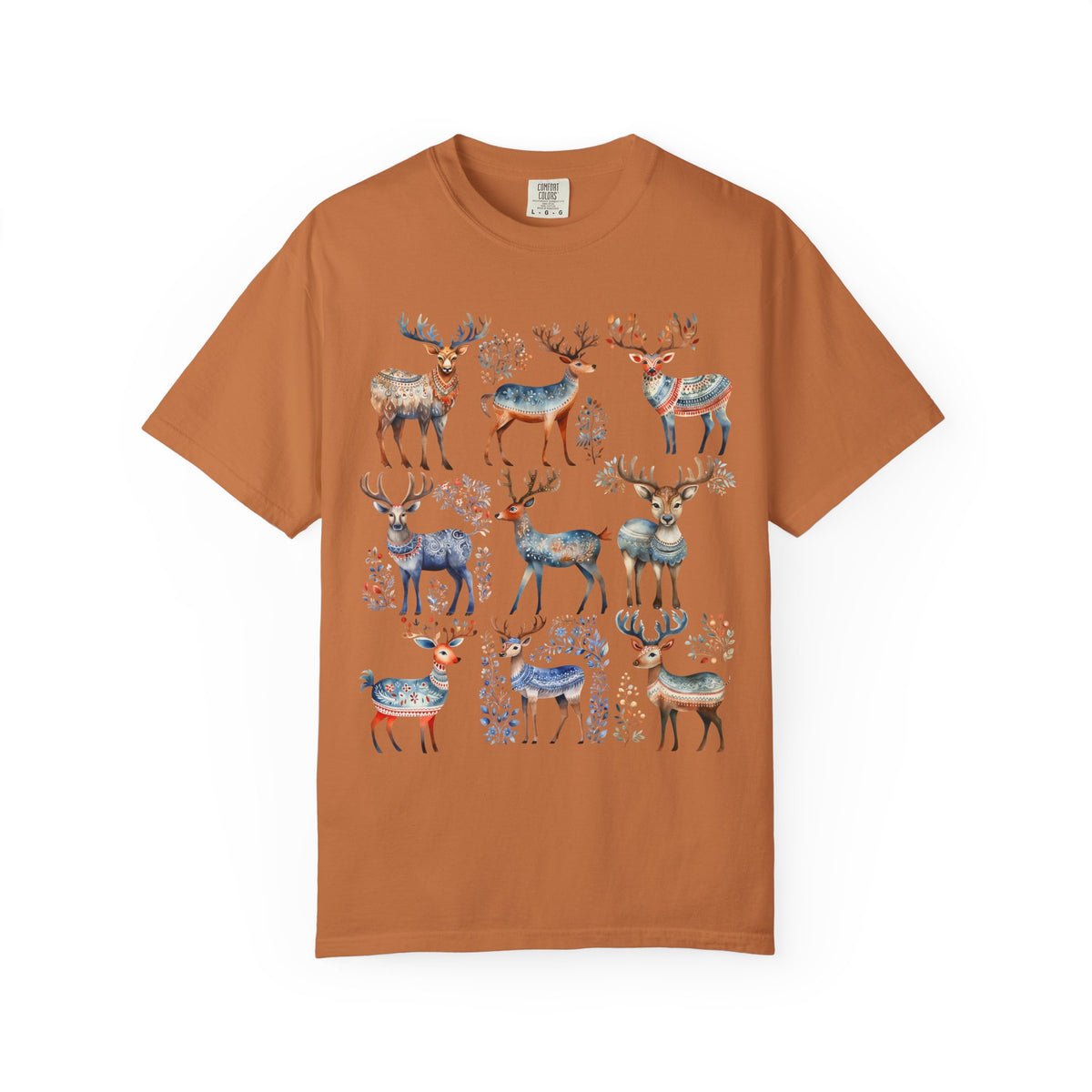 A rust-orange short-sleeve crewneck t-shirt featuring a graphic print of multiple watercolor-style deer in blue, gray, and brown tones with floral details, displayed flat against a white background.