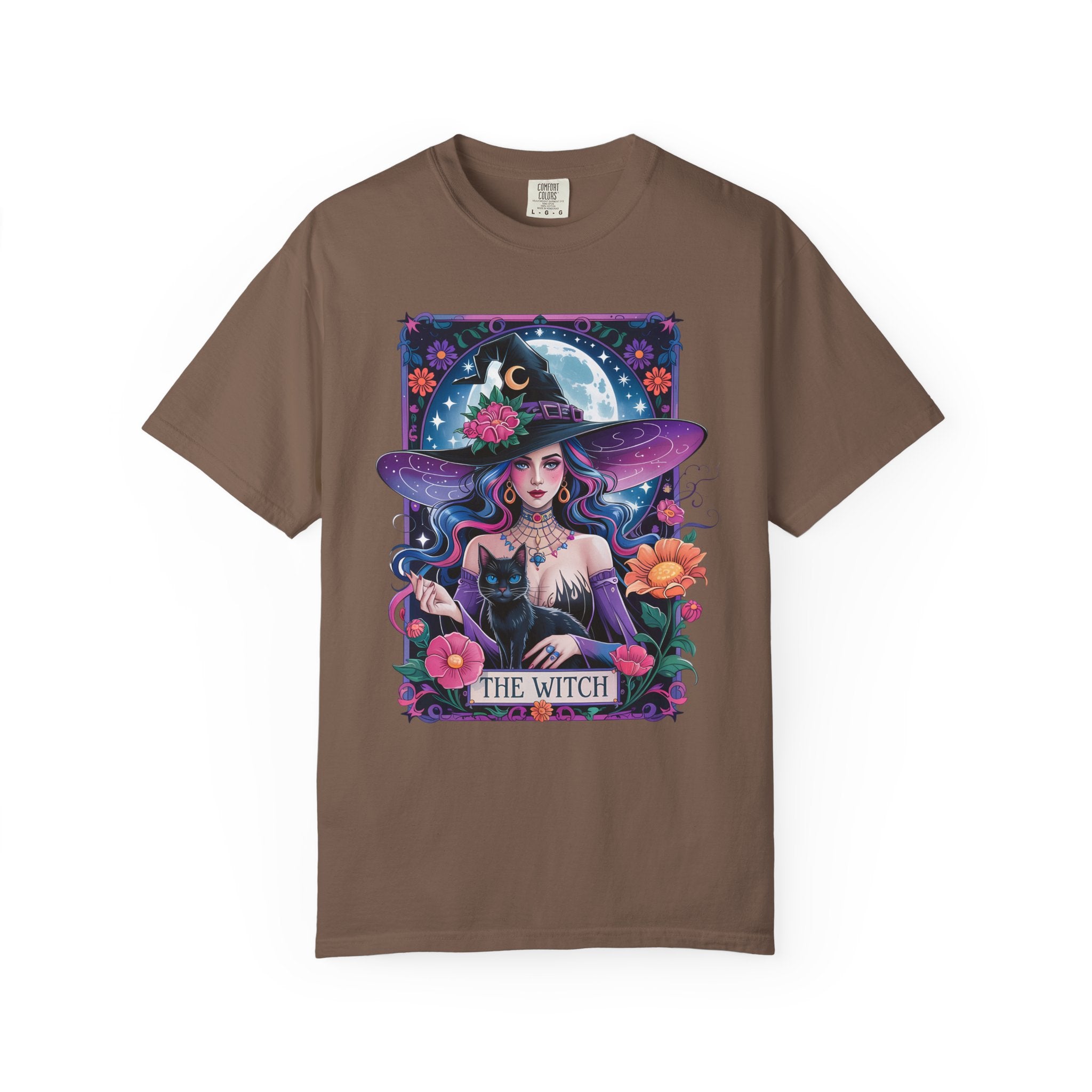 Illustration of a mystical witch with flowing hair, moonlit background, black cat, and floral celestial details on a Halloween shirt.