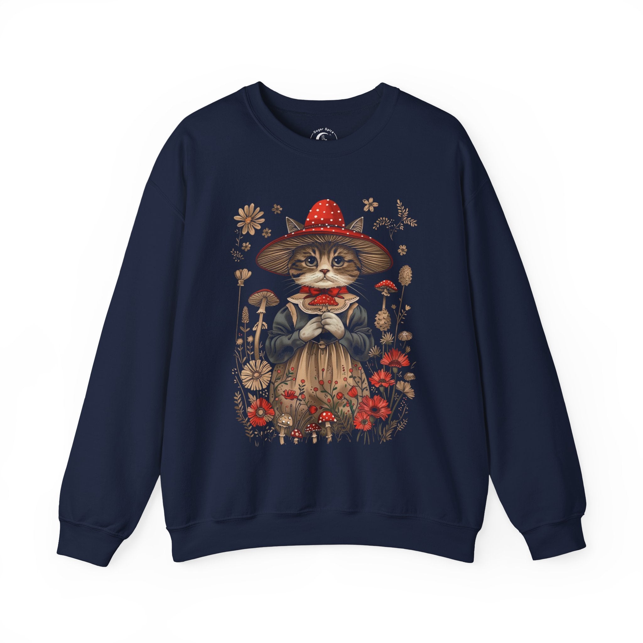 Cottagecore cat sweatshirt with whimsical cat in red mushroom witch hat and vintage dress surrounded by wildflowers and toadstools.
