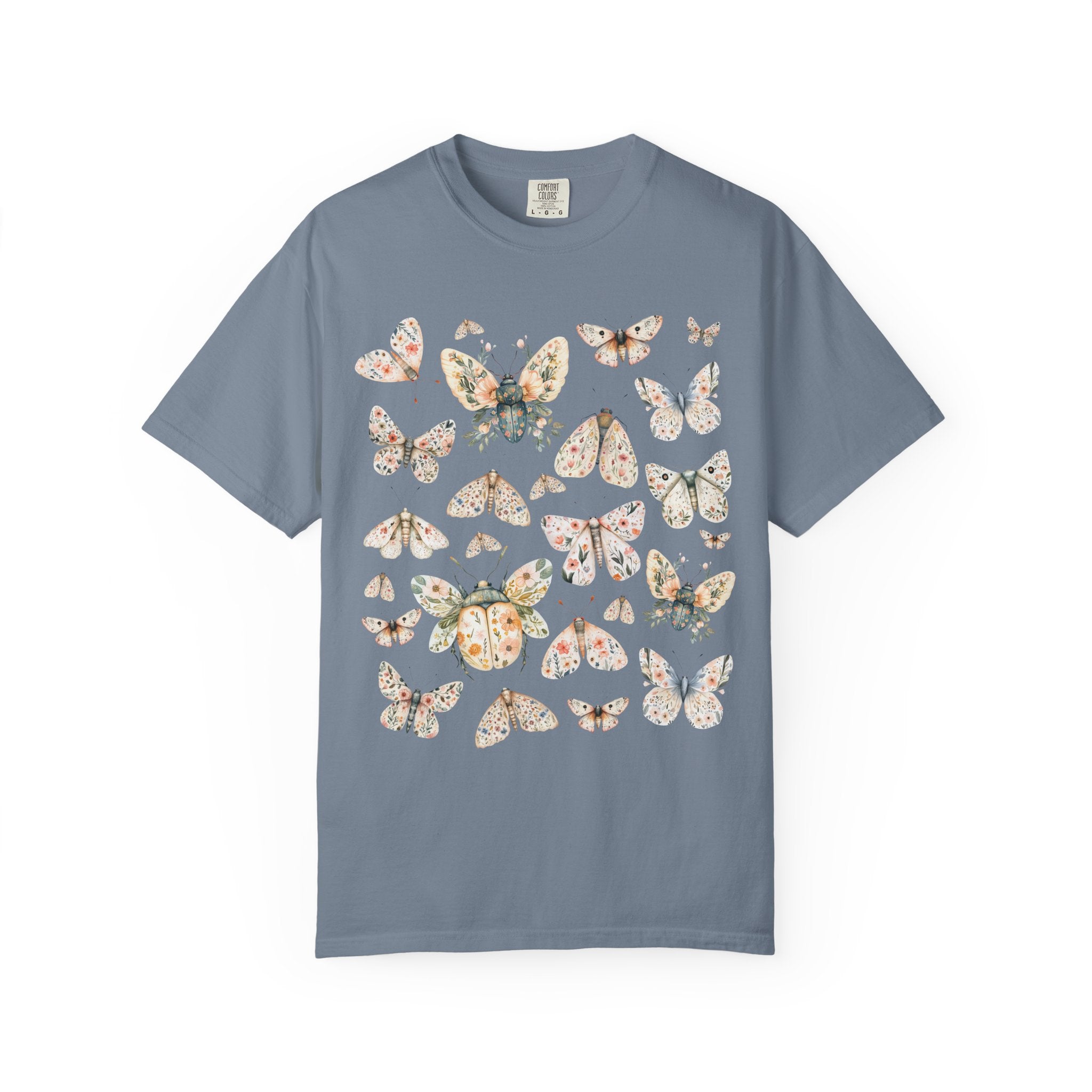 Floral butterfly and moth shirt design featuring pastel wings patterned with flowers, cottagecore nature aesthetic.