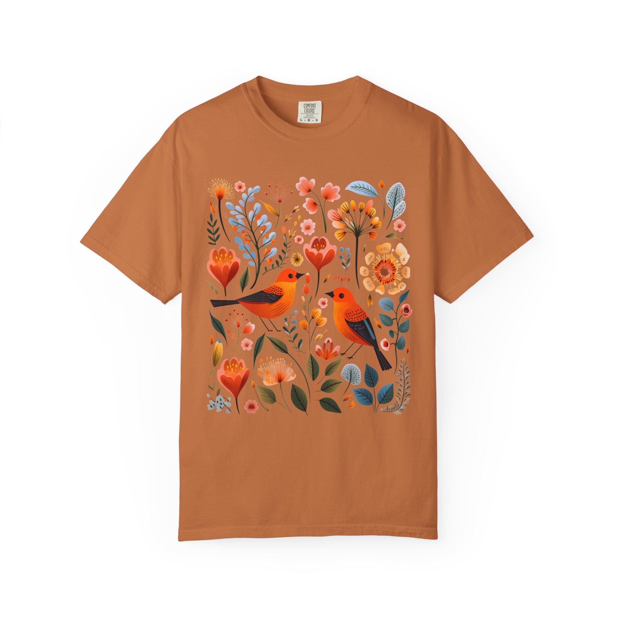 Scandinavian folk art design with two orange songbirds surrounded by blue and orange flowers in a Nordic floral pattern.