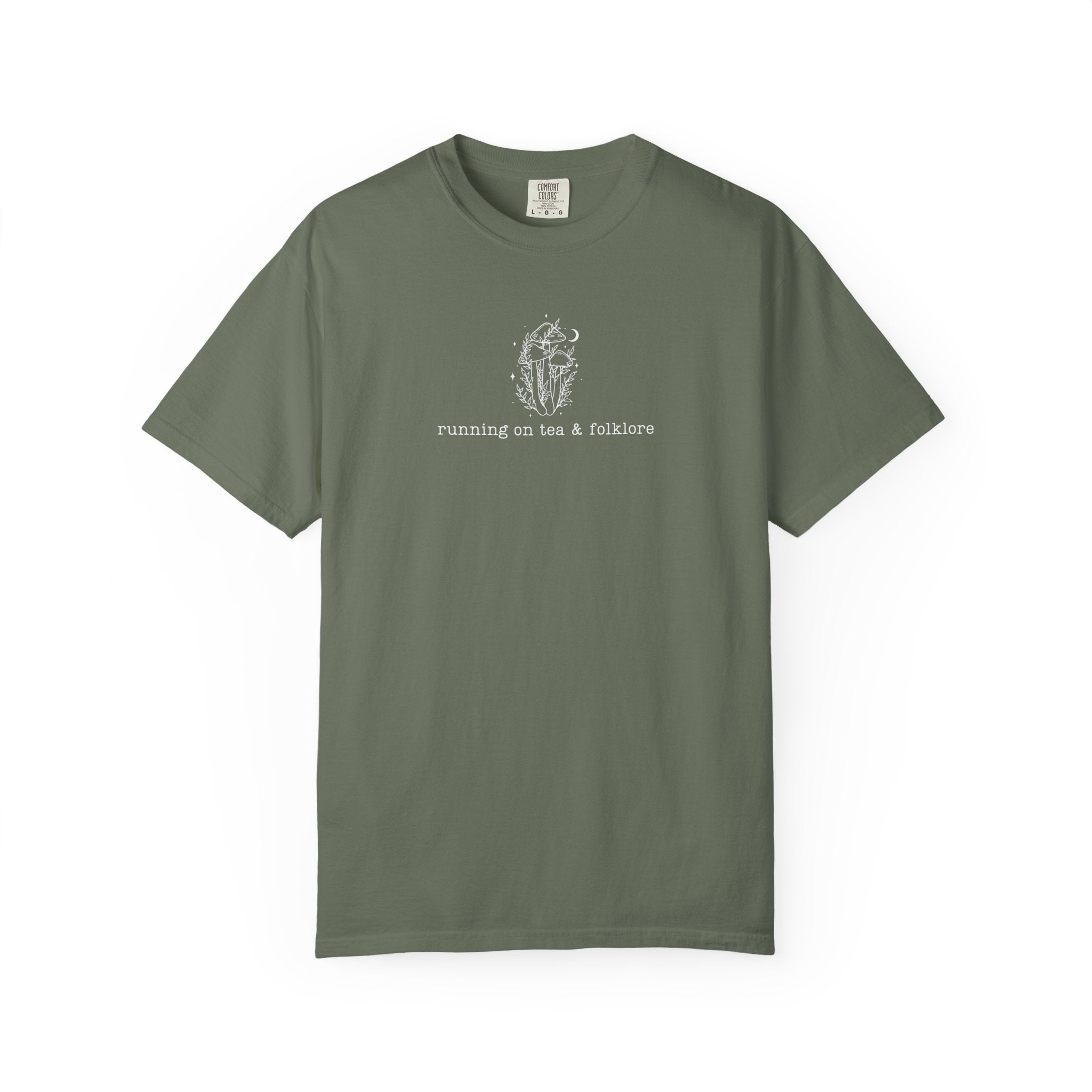 Minimalist whimsical mushroom illustration with moon details and the phrase “running on tea & folklore” in a cottagecore witchy aesthetic design.