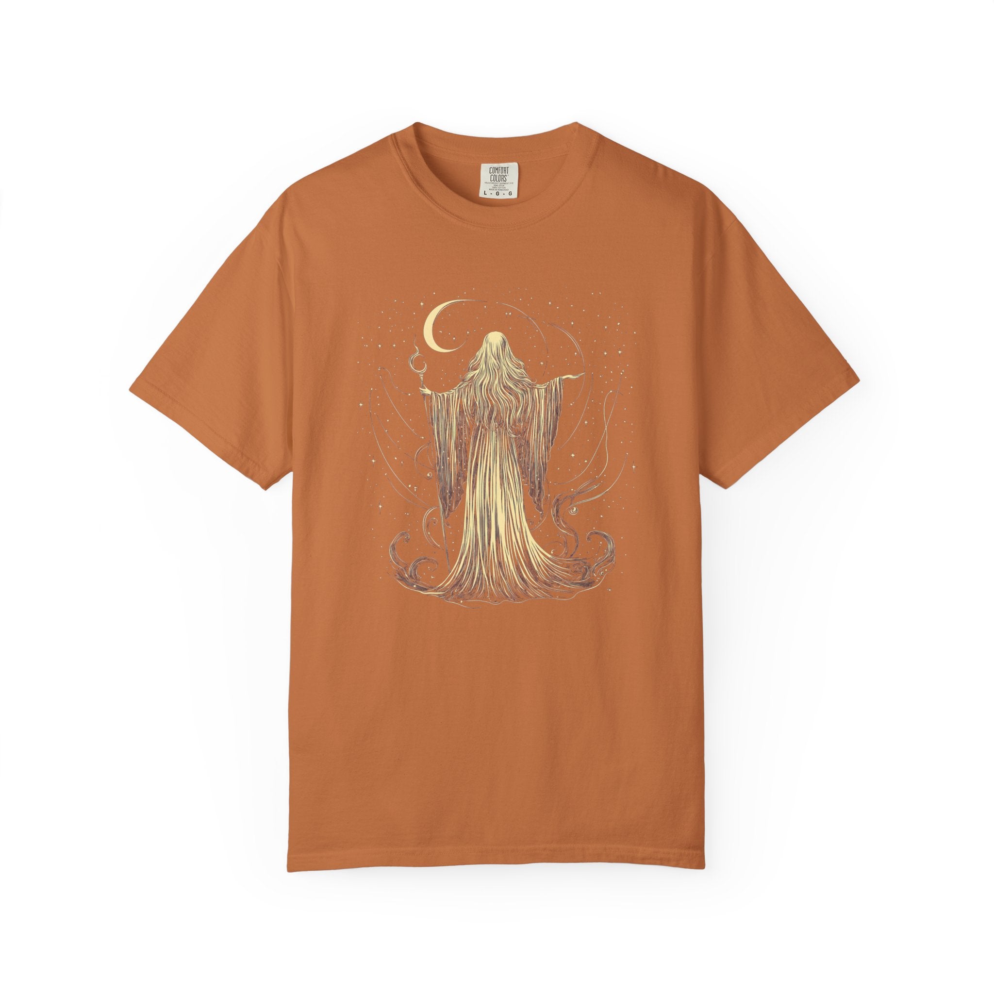 Vintage Comfort Colors t-shirt featuring an elegant moon priestess standing beneath a crescent moon surrounded by stars and flowing celestial magic. Available in Blue Jean, Espresso, Pepper, and Black.