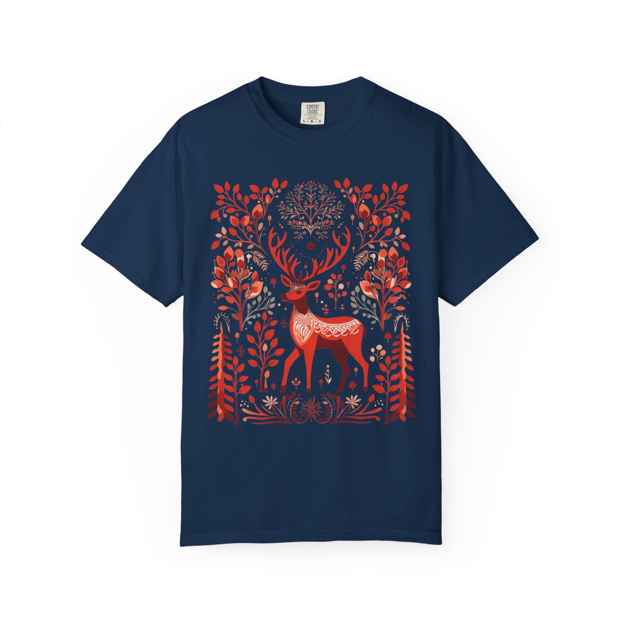 Nordic folk art illustration of a red deer surrounded by stylised branches, leaves, and forest motifs in a Scandinavian-inspired design, printed on a Comfort Colors shirt.
