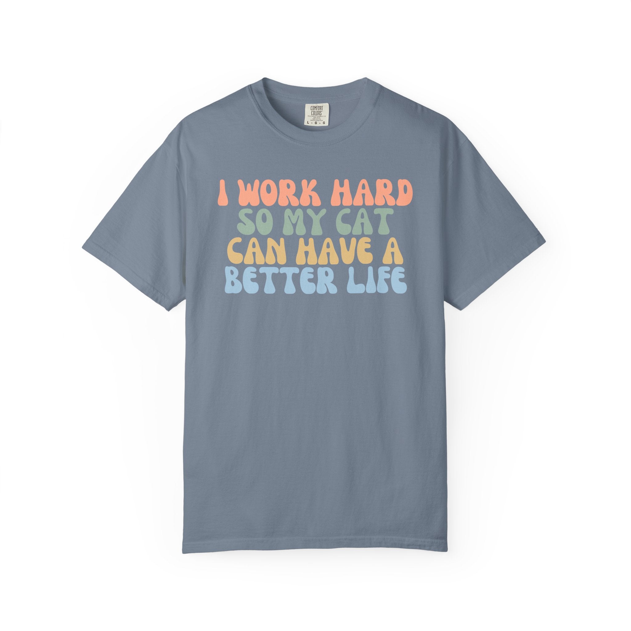 Comfort Colors graphic t-shirt featuring the funny retro quote "I Work Hard So My Cat Can Have A Better Life" in colorful vintage lettering for cat lovers and proud pet parents.