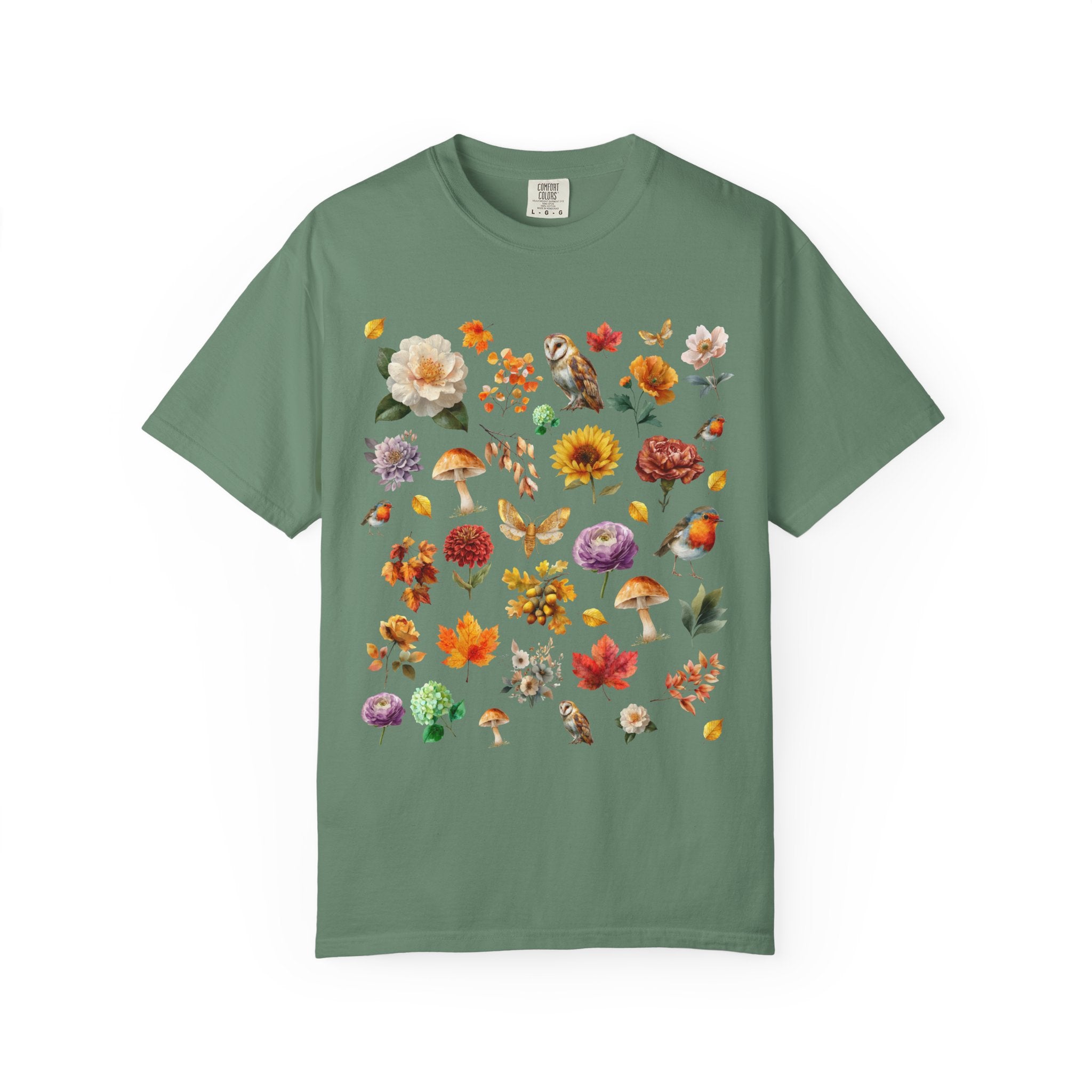 Watercolor woodland collage design featuring owls, robins, mushrooms, butterflies, fall leaves, and florals on an autumn cottagecore shirt.