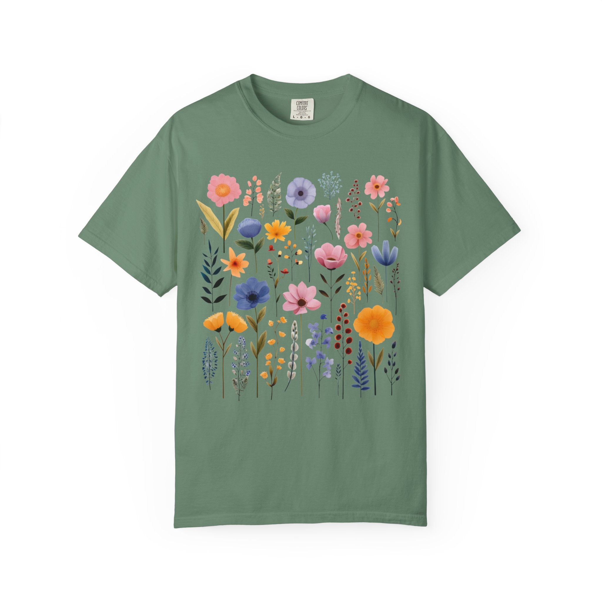 Comfort Colors shirt featuring a pastel Nordic wildflower botanical design with soft pink, blue, and yellow florals in a cottagecore style
