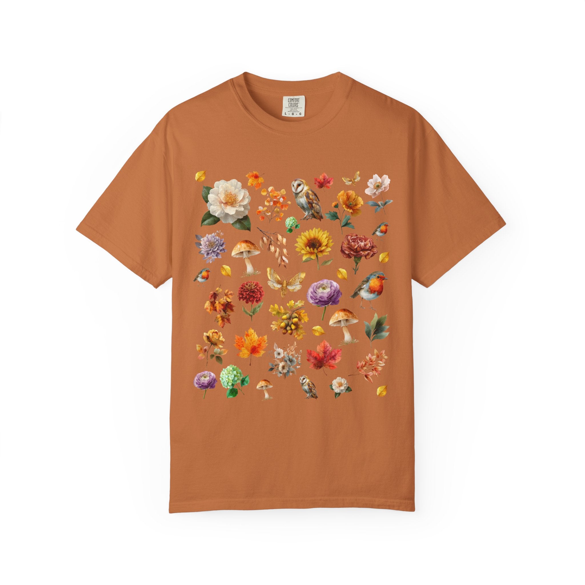 Watercolor woodland collage design featuring owls, robins, mushrooms, butterflies, fall leaves, and florals on an autumn cottagecore shirt.