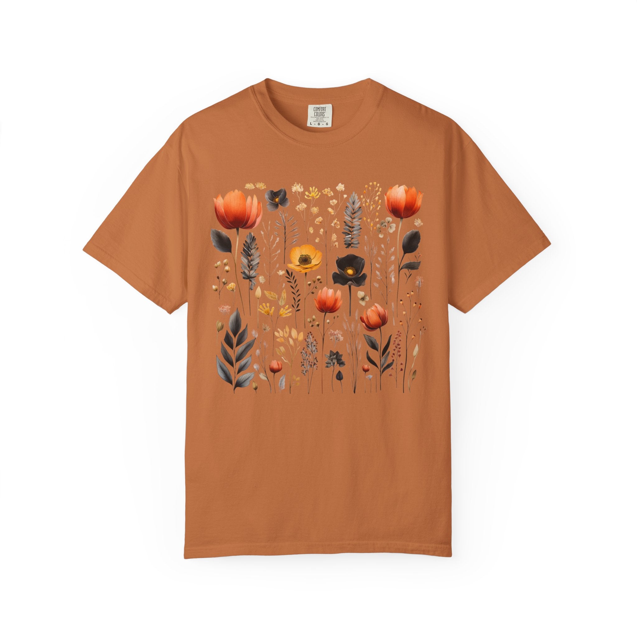 Comfort Colors Pepper shirt featuring a Nordic wildflower botanical design with orange, yellow, and charcoal florals in a cottagecore style