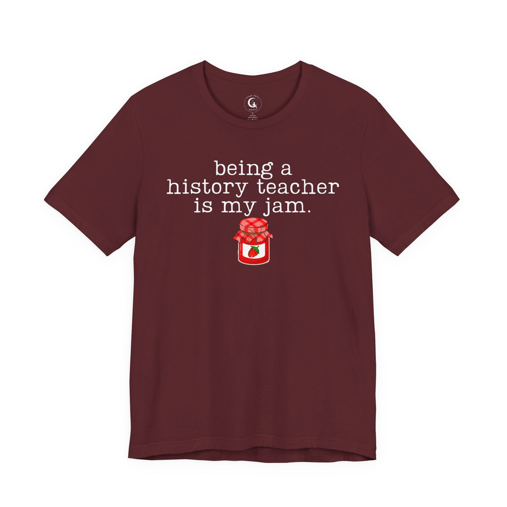 Shop the “Being a History Teacher Is My Jam” shirt featuring a cute strawberry jam design. A funny history teacher tee for school outfits, teacher gifts and back to school.