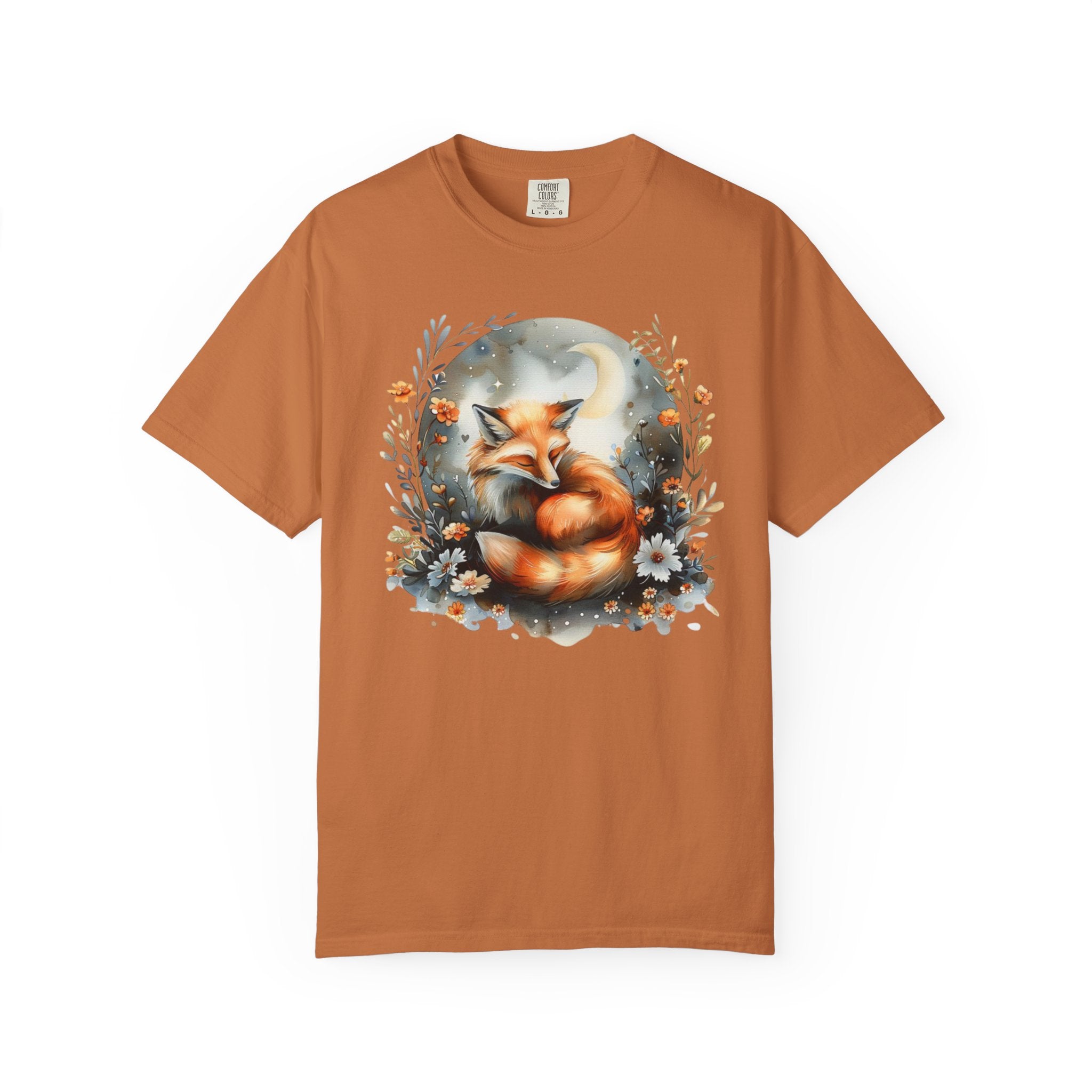 Sleeping fox surrounded by flowers and a crescent moon — cozy cottagecore forestcore design on soft Comfort Colors shirt.