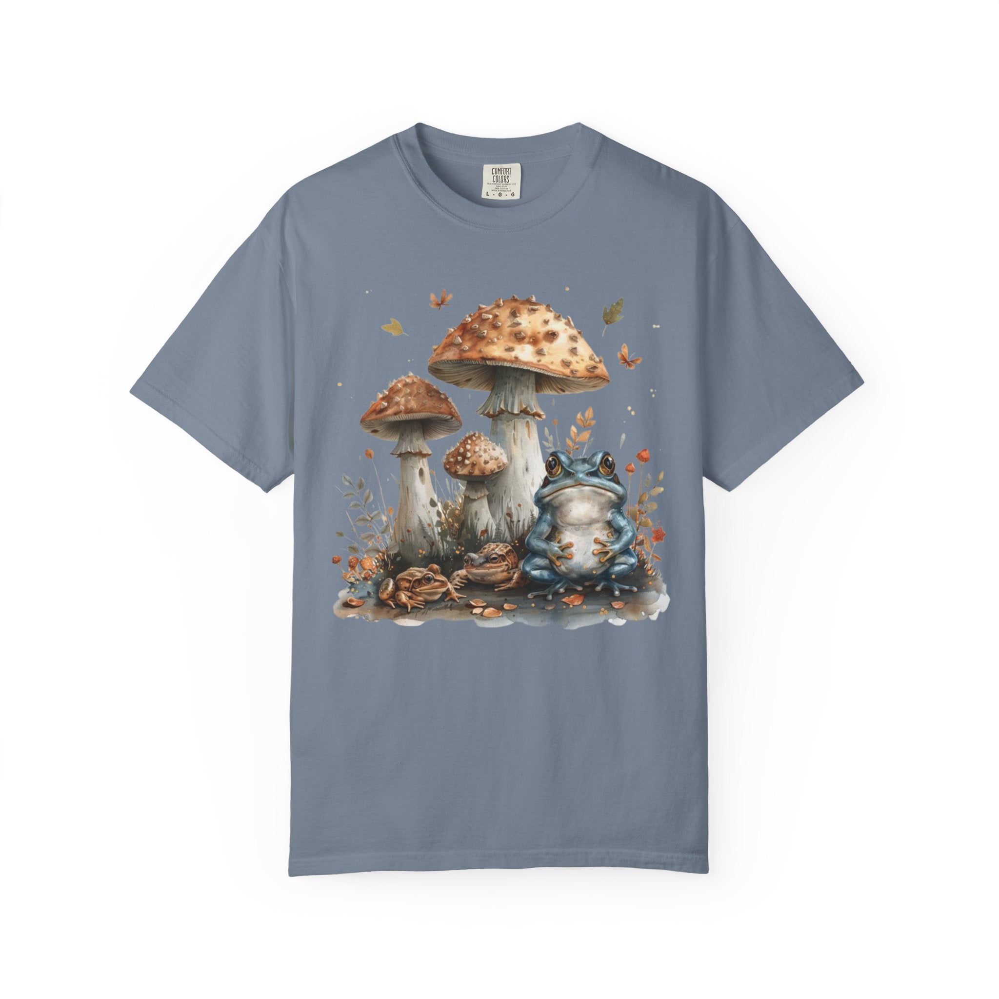 Illustrated frogs sitting beneath tall woodland mushrooms with leaves and forest details in a whimsical cottagecore style on a black background.