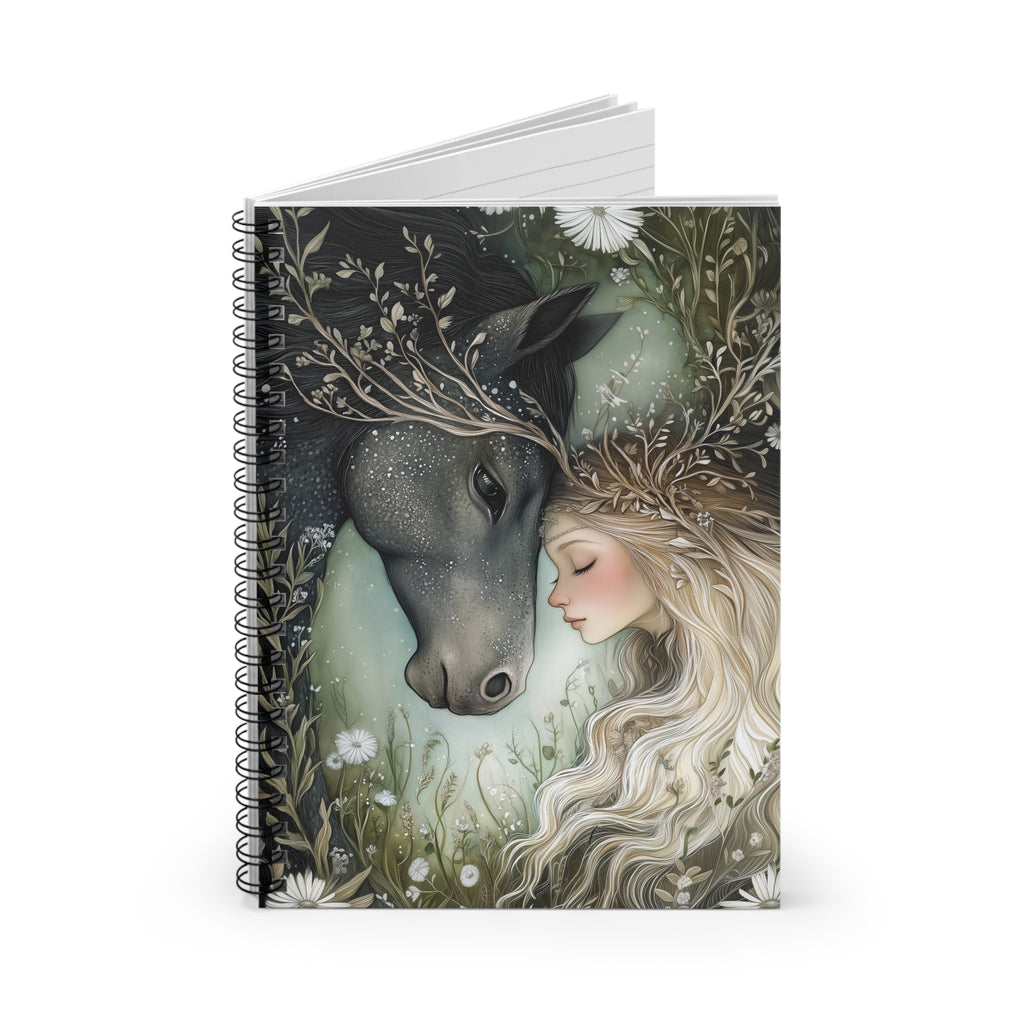 Notebook with a design of a woman and a deer on the cover, surrounded by nature.