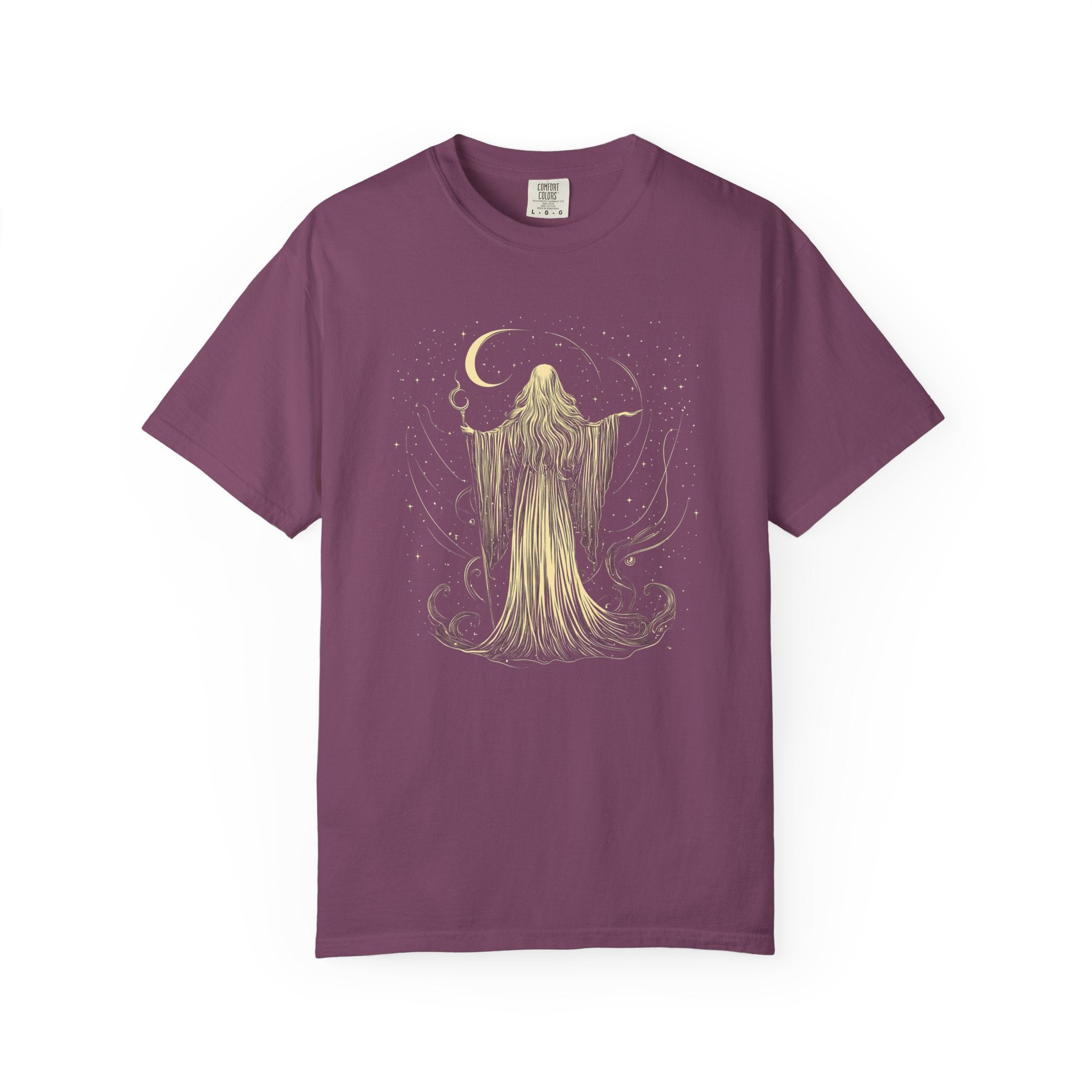 Vintage Comfort Colors t-shirt featuring an elegant moon priestess standing beneath a crescent moon surrounded by stars and flowing celestial magic. Available in Blue Jean, Espresso, Pepper, and Black.