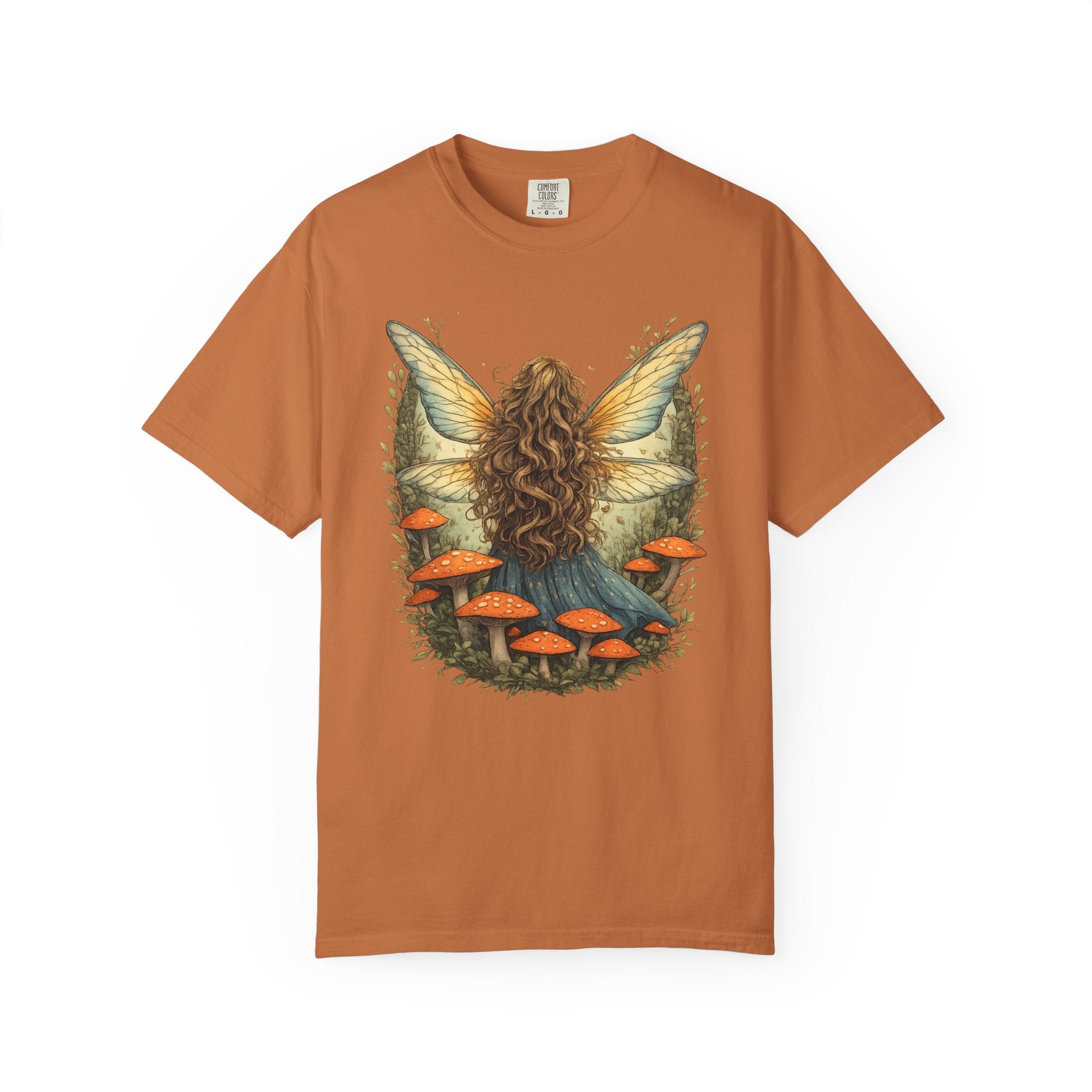 Whimsical fairy girl with glowing wings surrounded by orange mushrooms in an enchanted forest, cottagecore fairycore aesthetic shirt design.