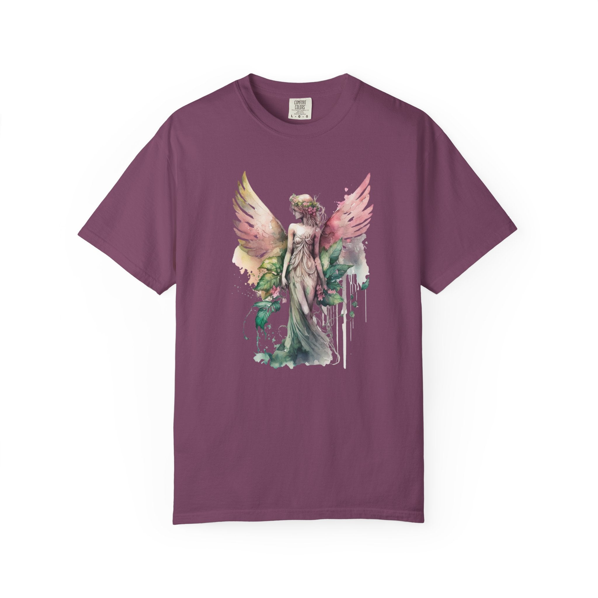 A short-sleeve crewneck t-shirt in a muted plum purple color, featuring a central graphic print of a winged angel figure with pastel pink, green, and gold watercolor details.