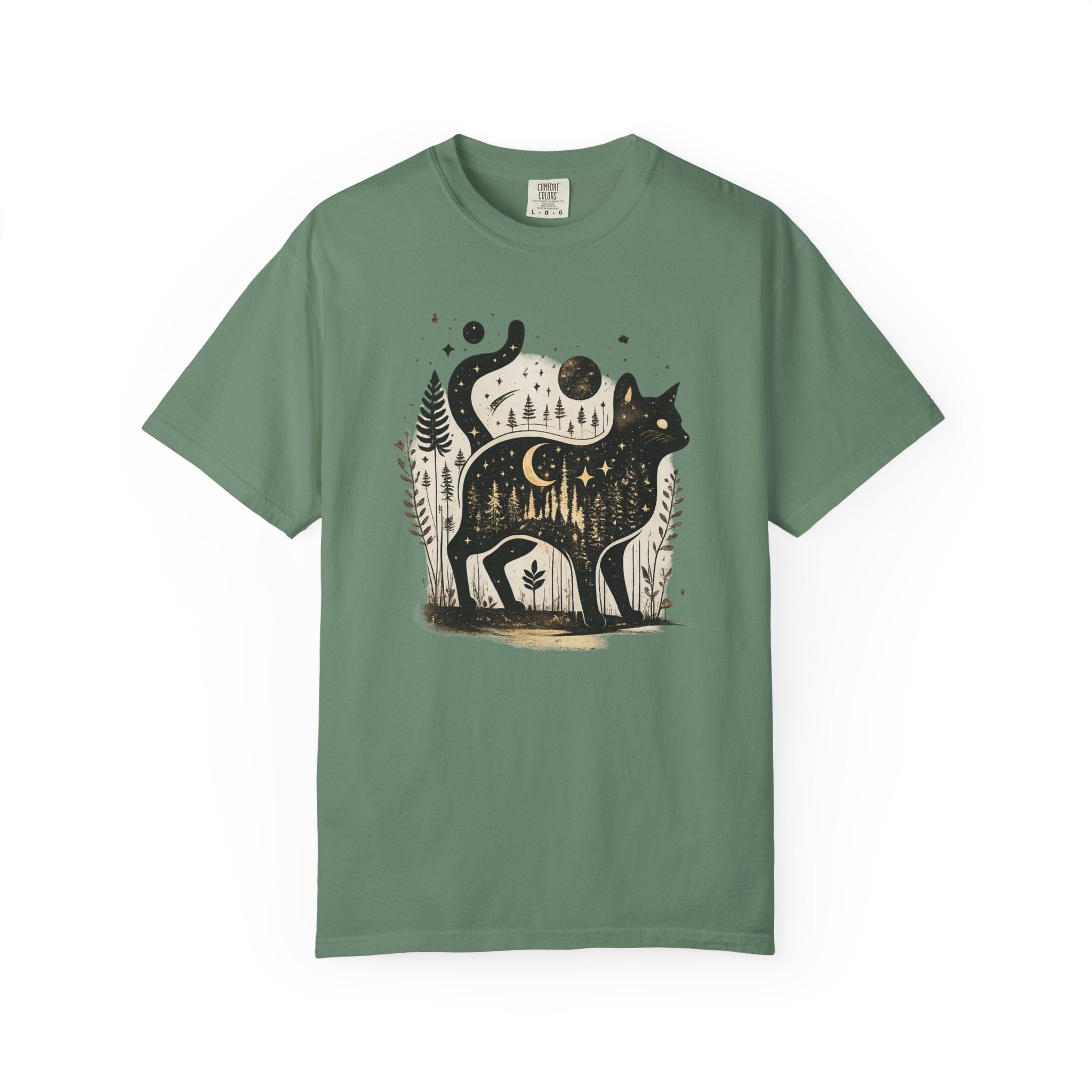 Comfort Colors cottagecore shirt featuring a magical black cat silhouette filled with a moonlit forest scene, stars, crescent moon, and woodland details. Available in orchid, blue jean, espresso, and ivory colors.