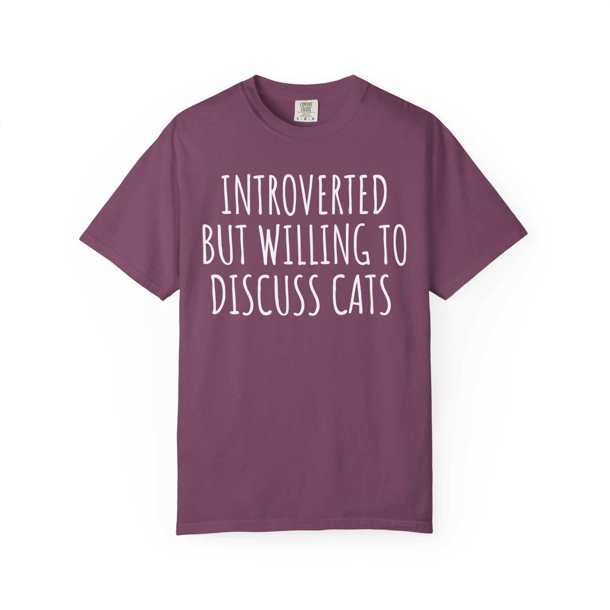 Funny Comfort Colors cat lover shirt featuring the phrase "Introverted But Willing to Discuss Cats," designed for introverts, cat moms, cat dads, and pet lovers.