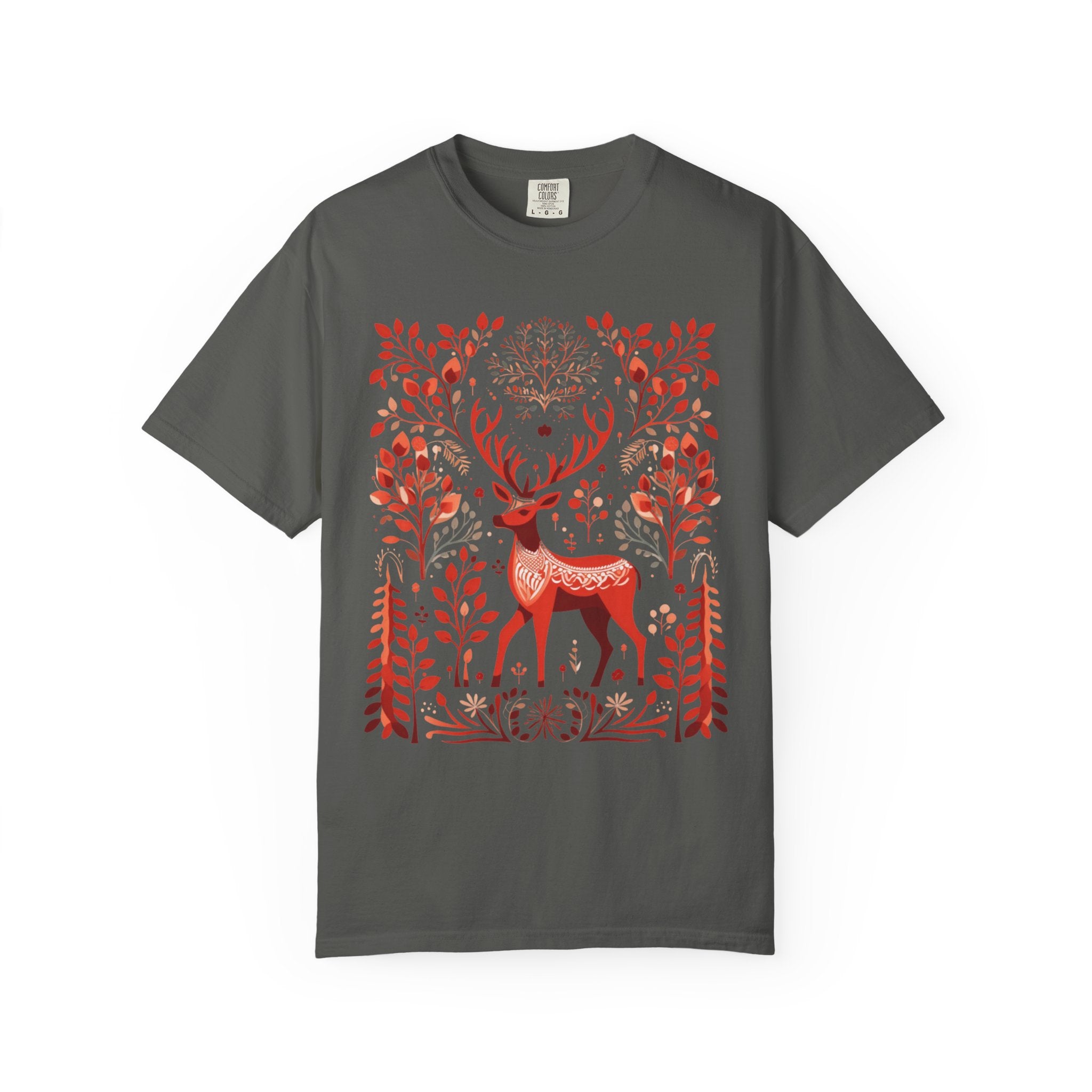Nordic folk art illustration of a red deer surrounded by stylised branches, leaves, and forest motifs in a Scandinavian-inspired design, printed on a Comfort Colors shirt.