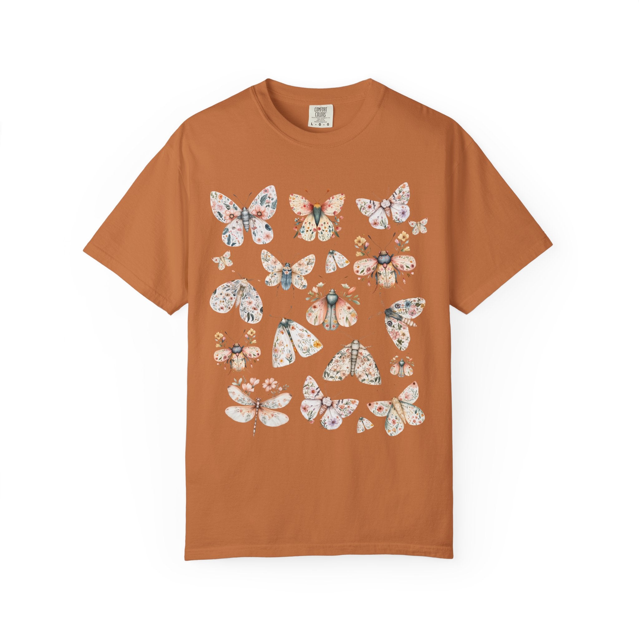 Cottagecore floral moth and butterfly shirt design with pastel flowers on delicate wings.