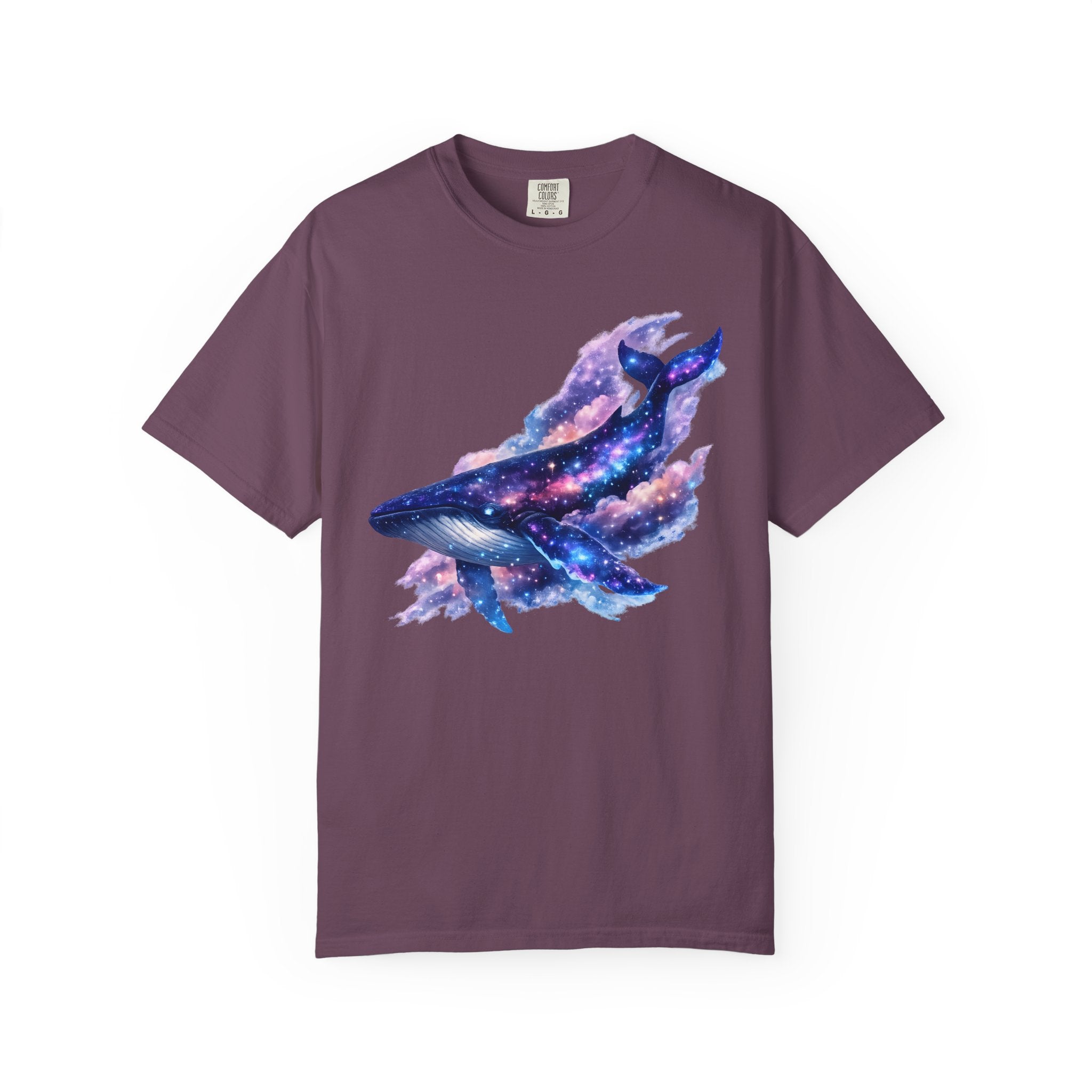 Celestial galaxy whale illustration with stars, nebula clouds, and cosmic colors designed for a whimsical Comfort Colors shirt.