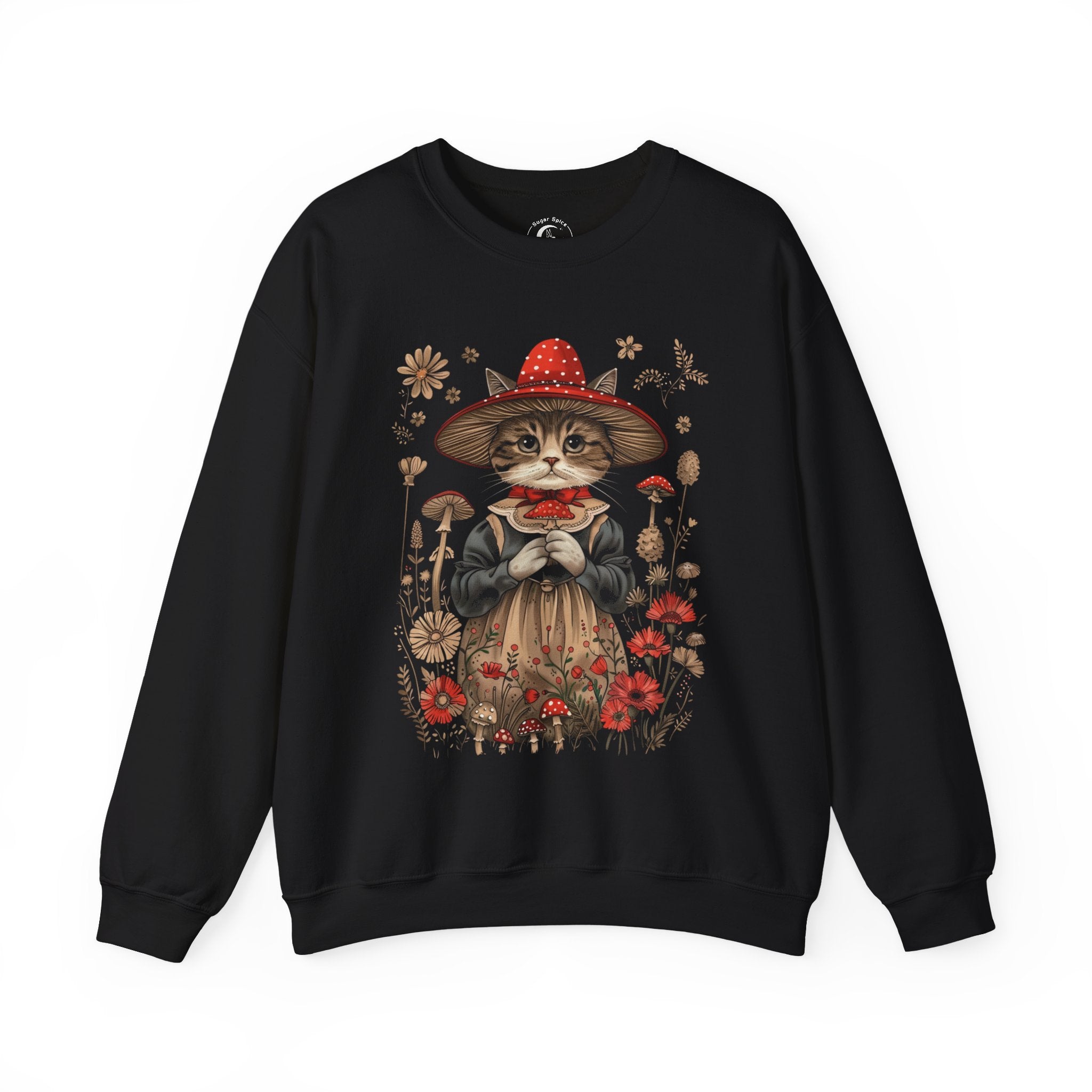 Cottagecore cat sweatshirt with whimsical cat in red mushroom witch hat and vintage dress surrounded by wildflowers and toadstools.