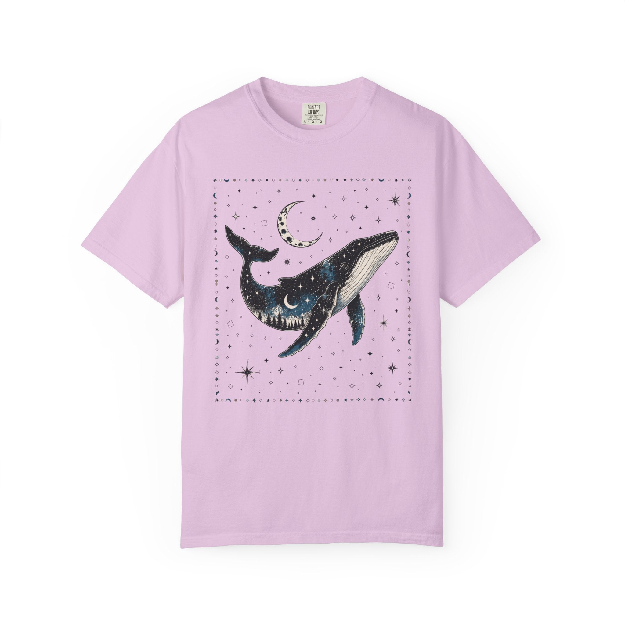 Comfort Colors ivory shirt featuring a celestial whale illustration filled with stars, moonlight, and a forest silhouette beneath a crescent moon.