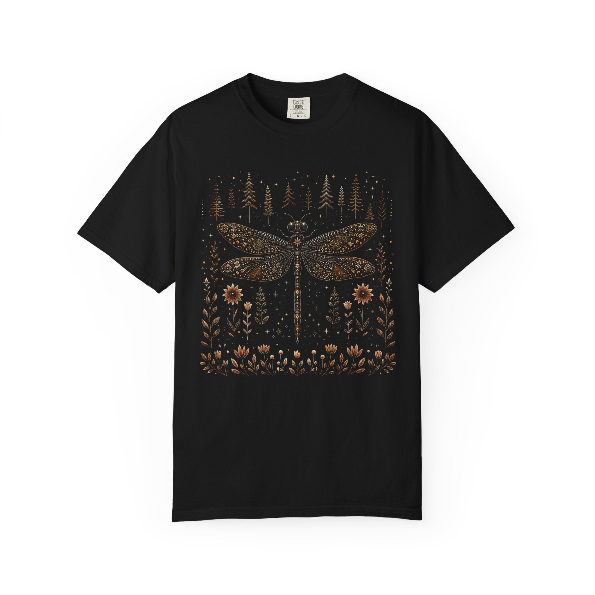 Whimsical vintage-style dragonfly illustration with intricate floral patterns on its wings, surrounded by wildflowers, pine trees, stars, and celestial details in warm bronze and cream tones against a black background.