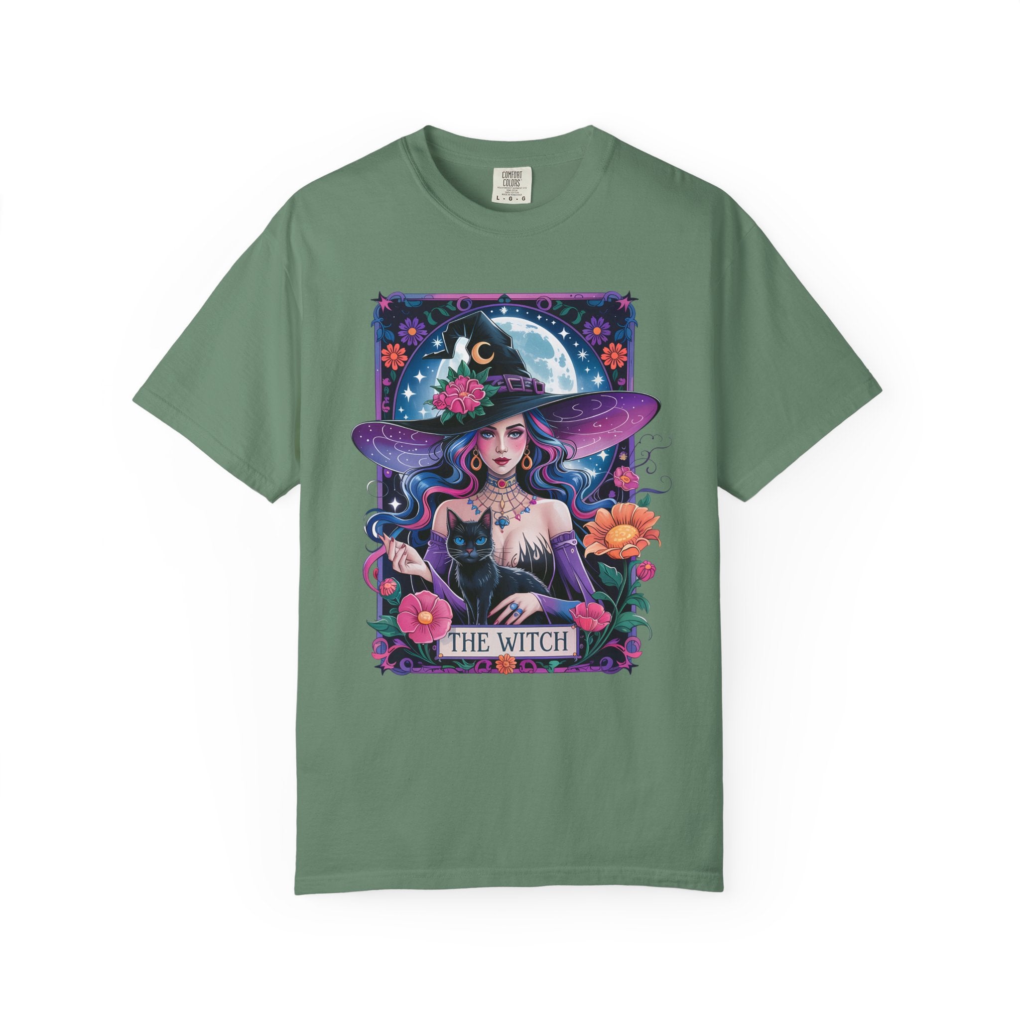 Illustration of a mystical witch with flowing hair, moonlit background, black cat, and floral celestial details on a Halloween shirt.