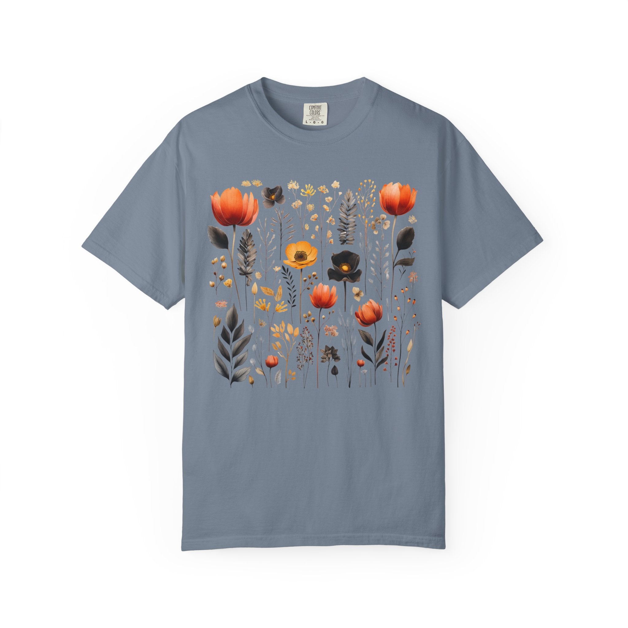 Comfort Colors Pepper shirt featuring a Nordic wildflower botanical design with orange, yellow, and charcoal florals in a cottagecore style