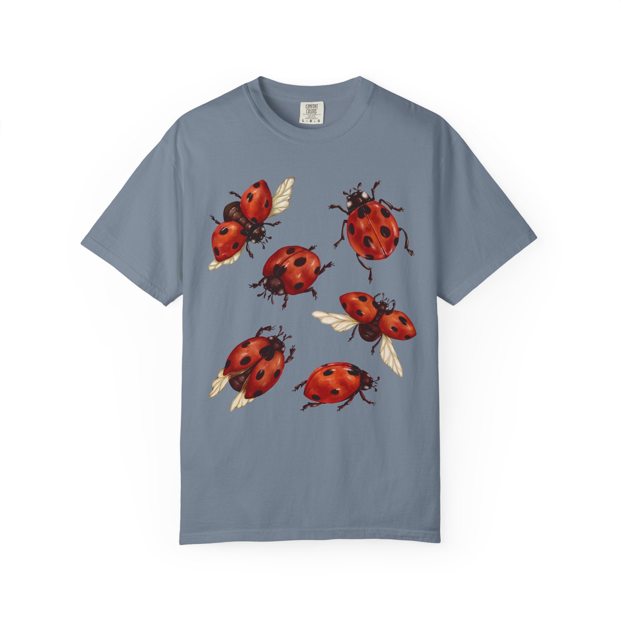 Watercolor red ladybugs design printed on a vintage-style Comfort Colors cottagecore shirt