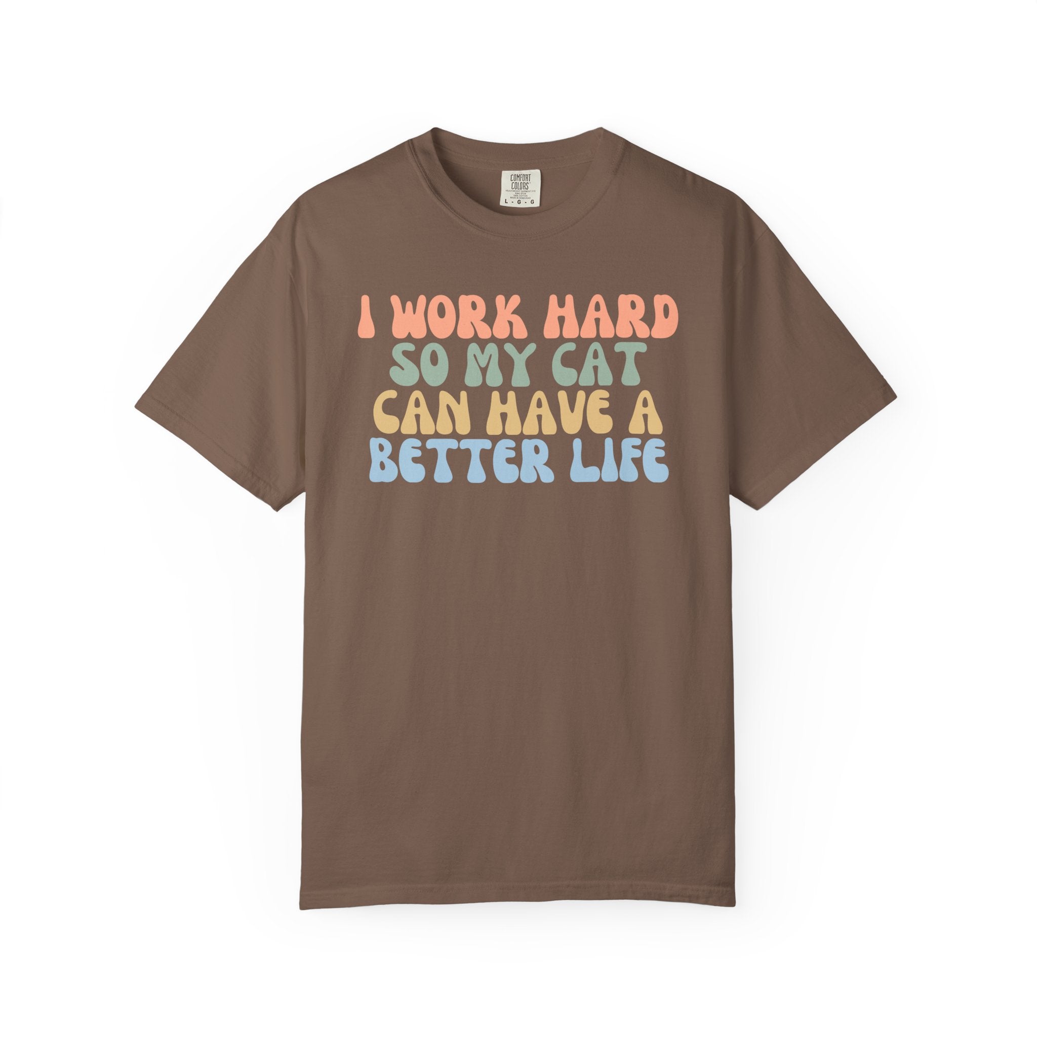 Comfort Colors graphic t-shirt featuring the funny retro quote "I Work Hard So My Cat Can Have A Better Life" in colorful vintage lettering for cat lovers and proud pet parents.