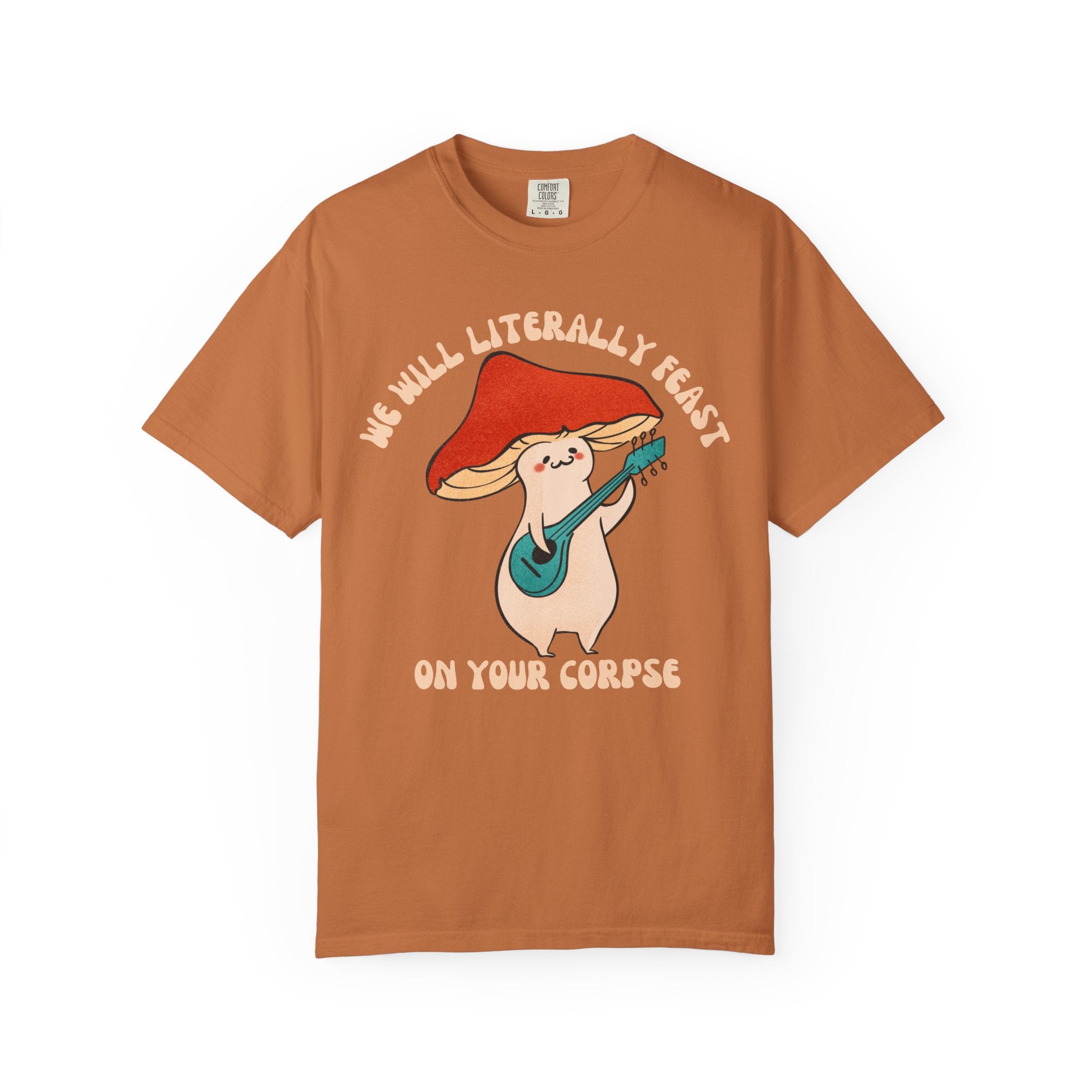 Cute cartoon mushroom playing guitar under a red cap with the quote “We Will Literally Feast on Your Corpse,” printed on a Comfort Colors tee.