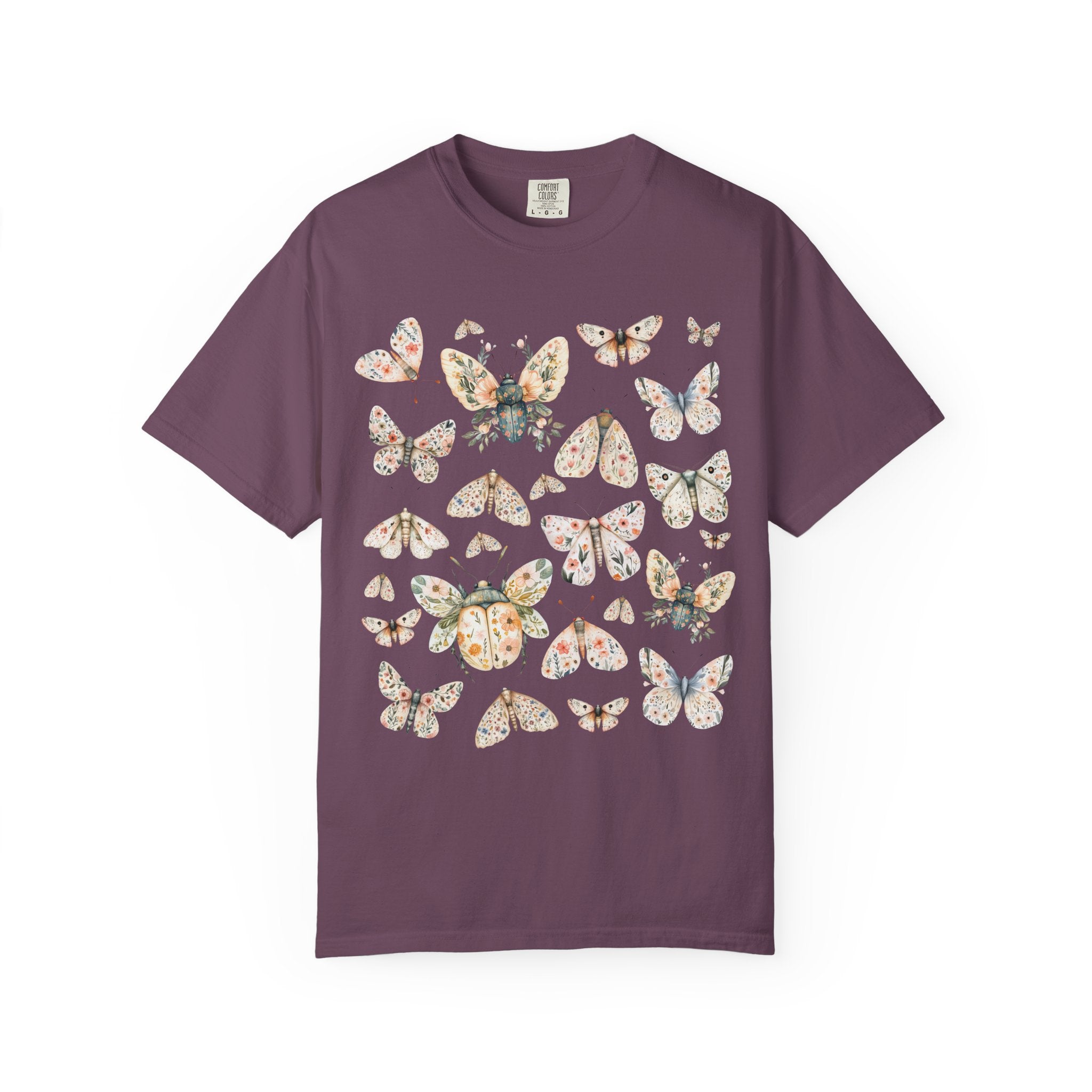 Floral butterfly and moth shirt design featuring pastel wings patterned with flowers, cottagecore nature aesthetic.