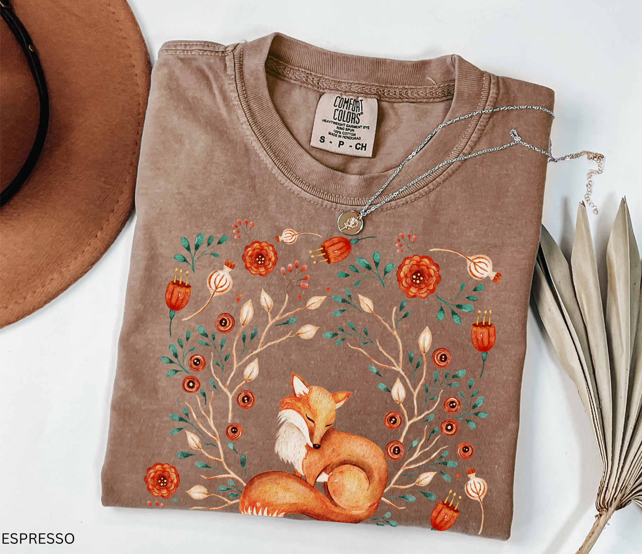 Illustration of a sleeping fox surrounded by autumn florals and branches — cozy cottagecore and forestcore aesthetic on a soft Comfort Colors shirt.