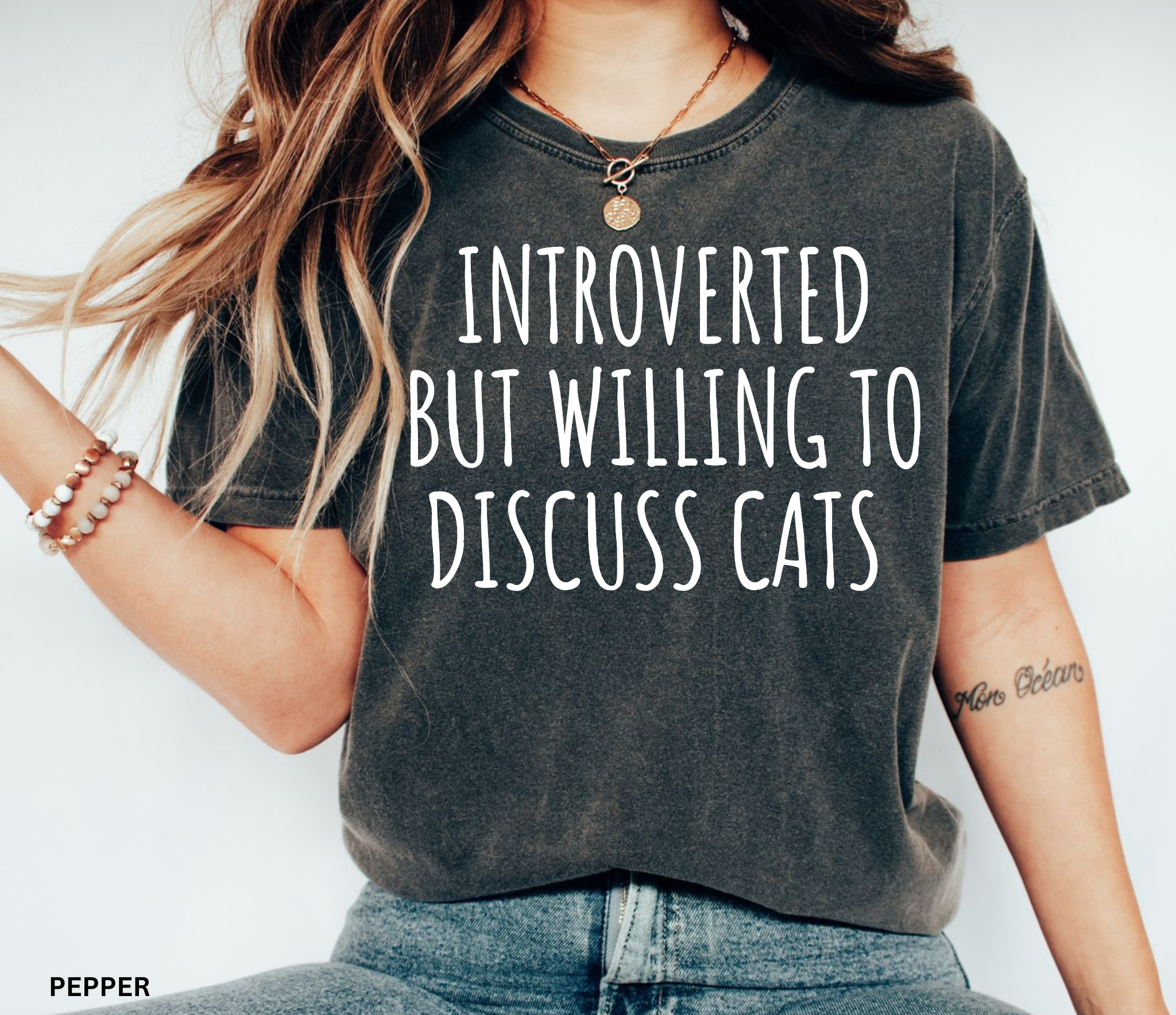 Funny Comfort Colors cat lover shirt featuring the phrase "Introverted But Willing to Discuss Cats," designed for introverts, cat moms, cat dads, and pet lovers.