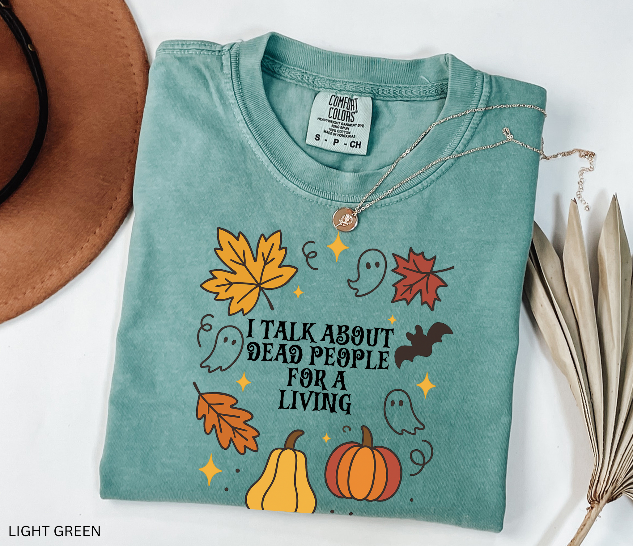 Halloween fall shirt with pumpkins, ghosts, bats, and autumn leaves in a festive design. Cute spooky season tee for fall and Halloween lovers