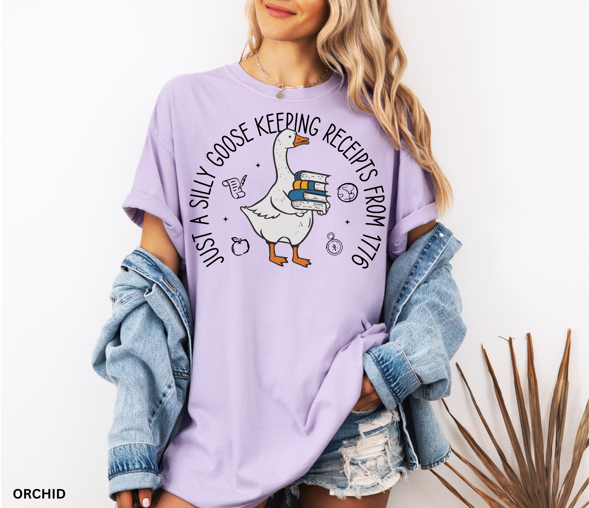 History teacher shirt with a goose holding books and the phrase ‘Just a Historical Goose Keeping Receipts from 1776.’ Funny teacher gift tee