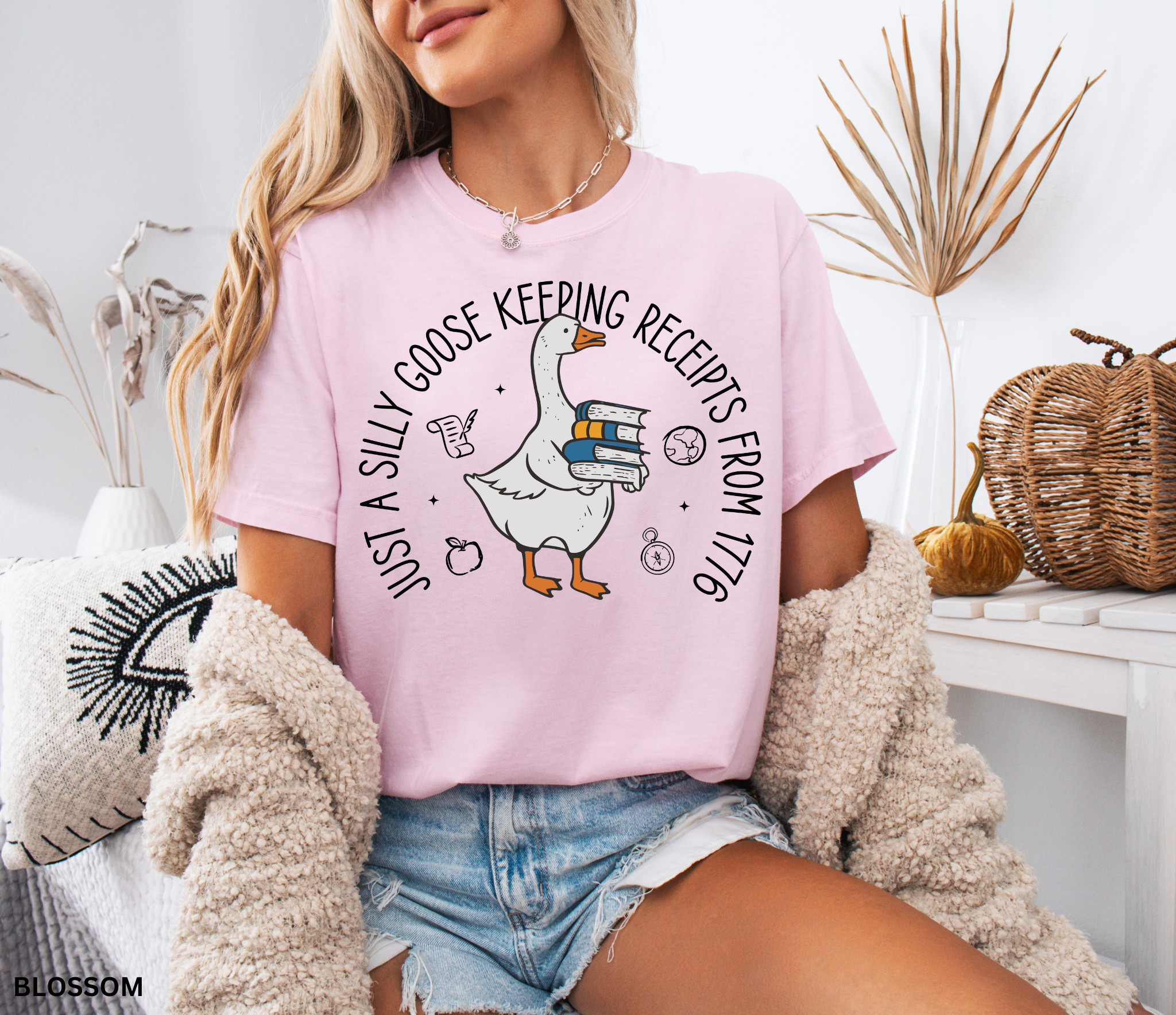 History teacher shirt with a goose holding books and the phrase ‘Just a Historical Goose Keeping Receipts from 1776.’ Funny teacher gift tee