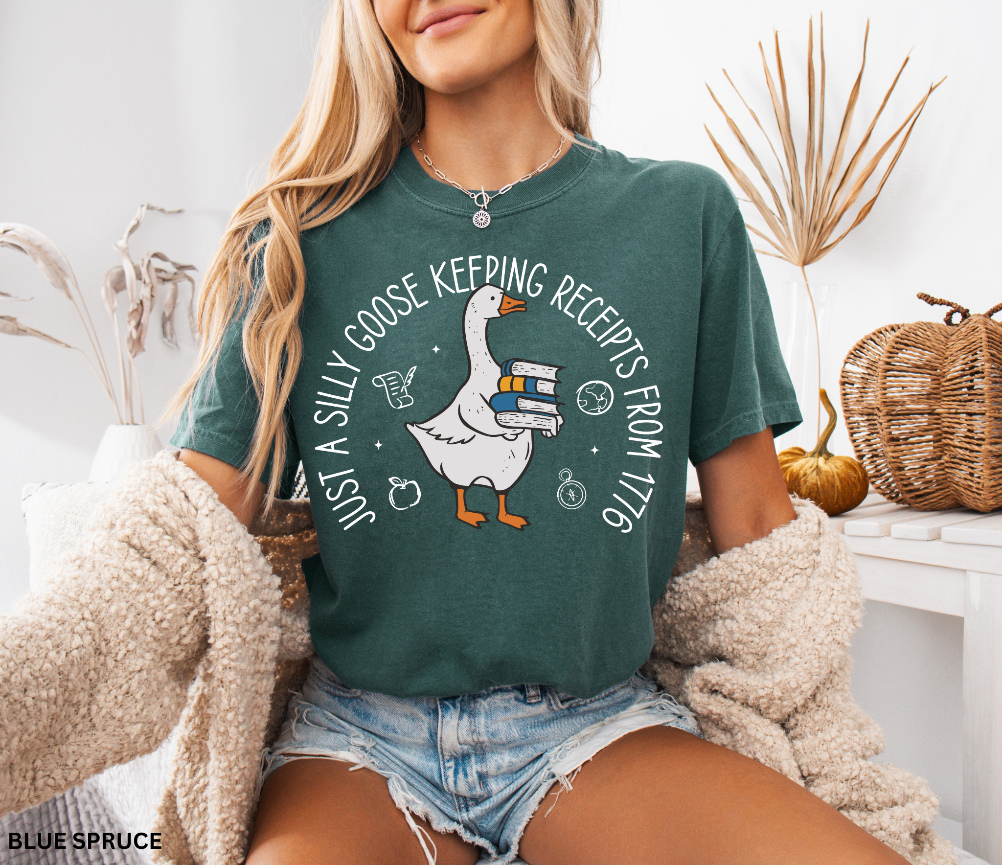 History teacher shirt with a goose holding books and the phrase ‘Just a Historical Goose Keeping Receipts from 1776.’ Funny teacher gift tee
