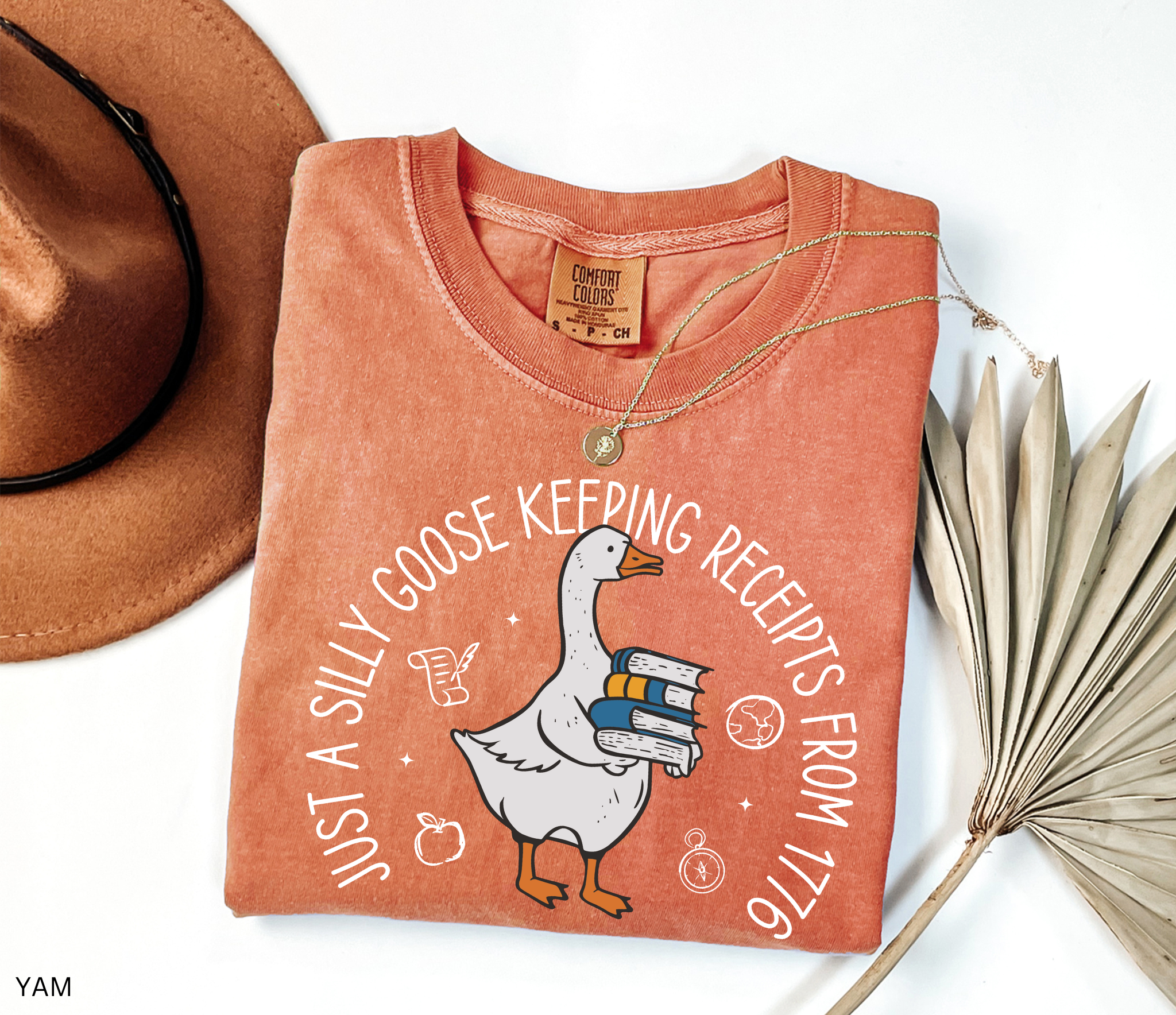 History teacher shirt with a goose holding books and the phrase ‘Just a Historical Goose Keeping Receipts from 1776.’ Funny teacher gift tee