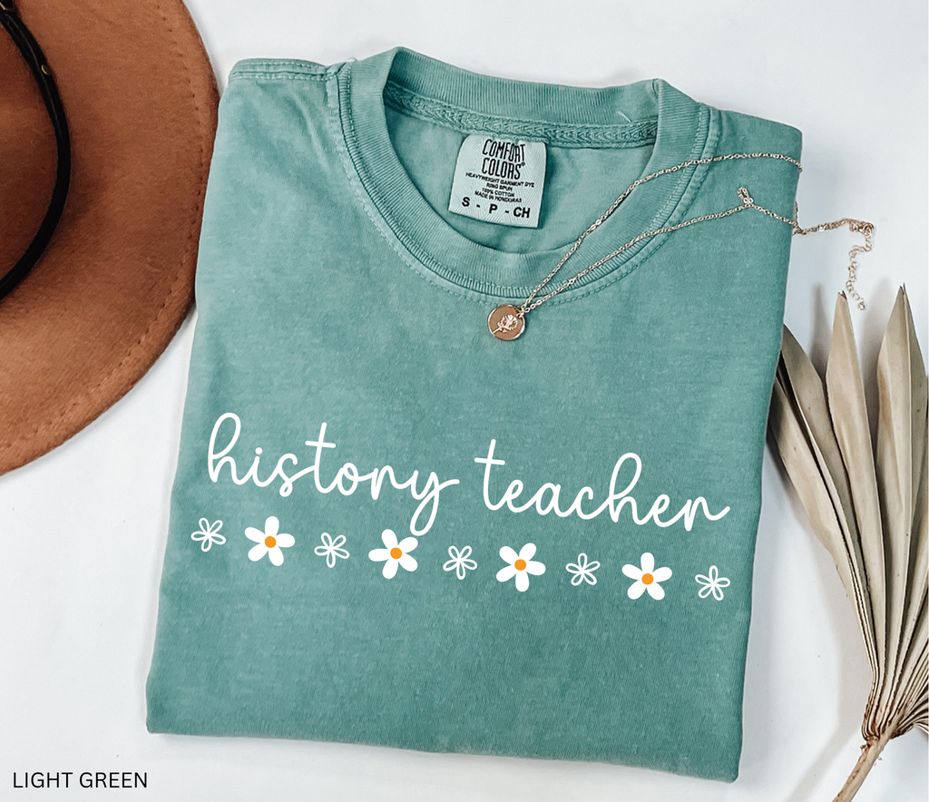 History teacher shirt with cursive text and daisy flower accents. Minimalist cute social studies teacher tee, perfect for classroom or teacher gift
