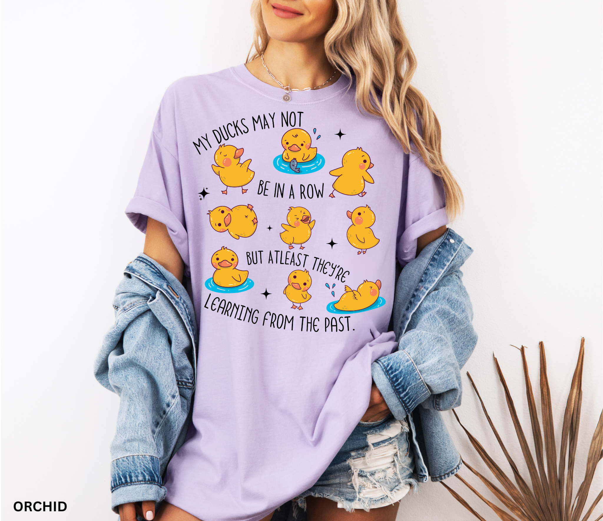 Funny history teacher shirt with yellow ducklings and the phrase ‘My ducks may not be in a row, but at least they’re learning from the past.’ Cute classroom teacher tee.