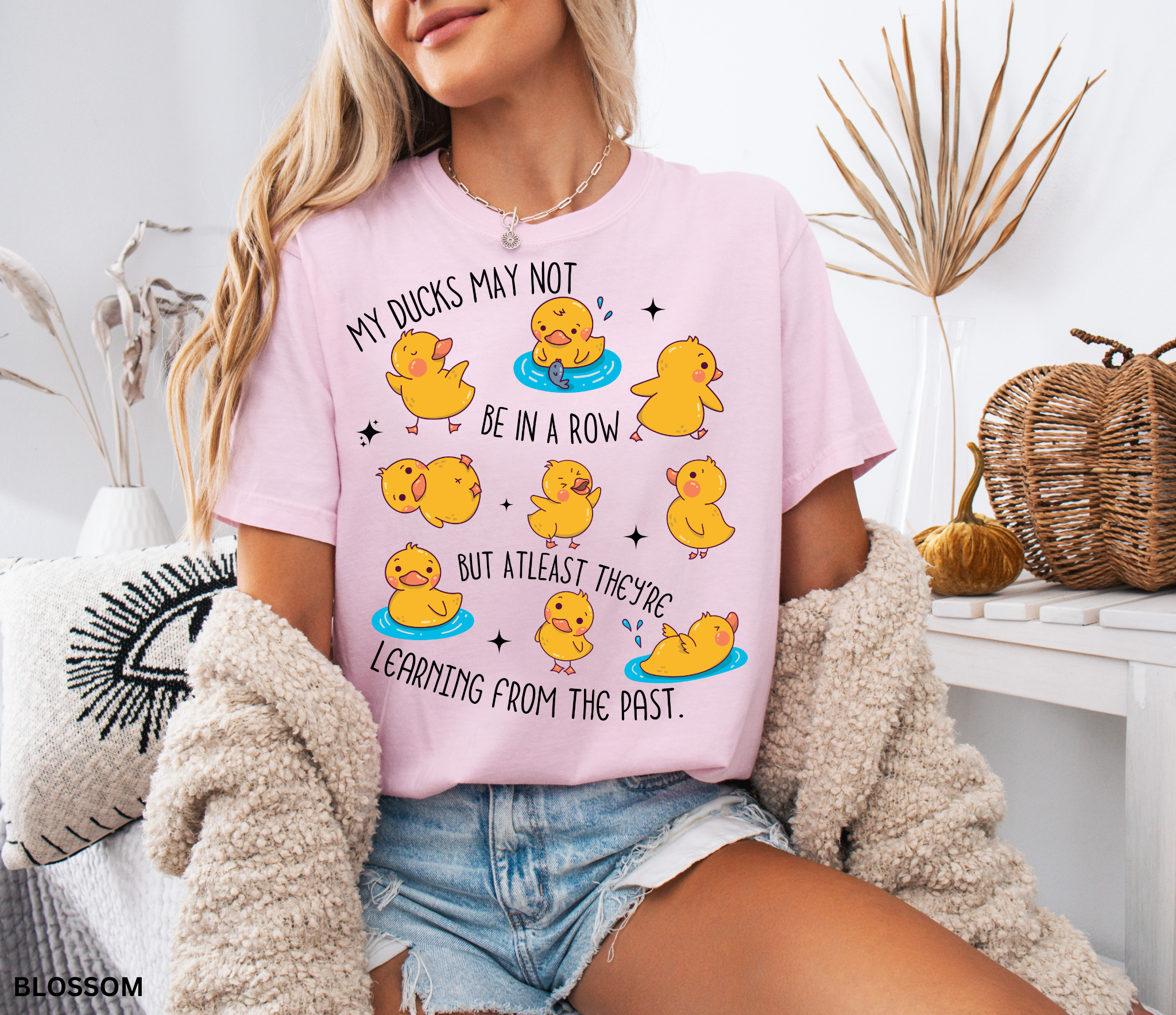 Funny history teacher shirt with yellow ducklings and the phrase ‘My ducks may not be in a row, but at least they’re learning from the past.’ Cute classroom teacher tee.