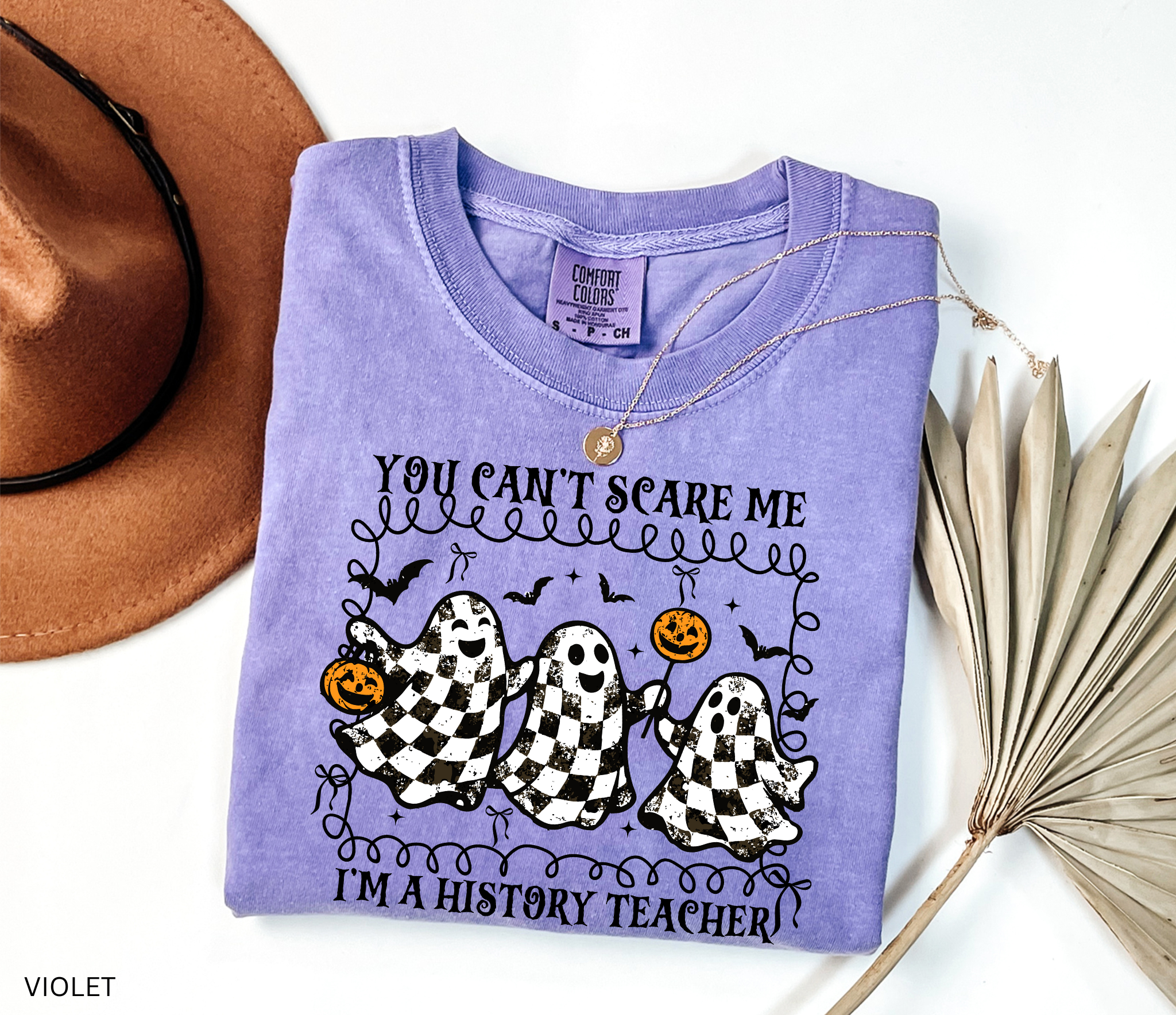 Halloween history teacher shirt with three distressed checkered ghosts holding pumpkins, surrounded by bats. Funny spooky social studies teacher tee.