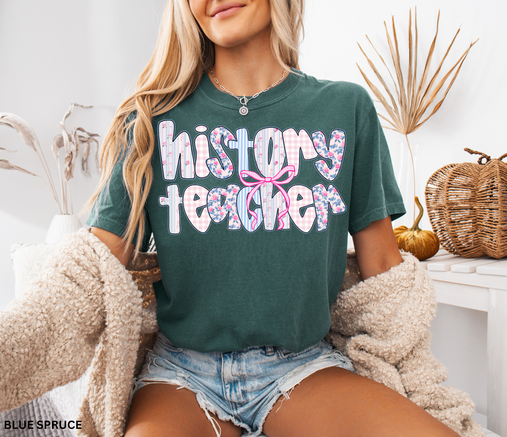 History teacher shirt with floral and gingham patchwork letters and a pink bow design. Cute and aesthetic retro-style teacher tee