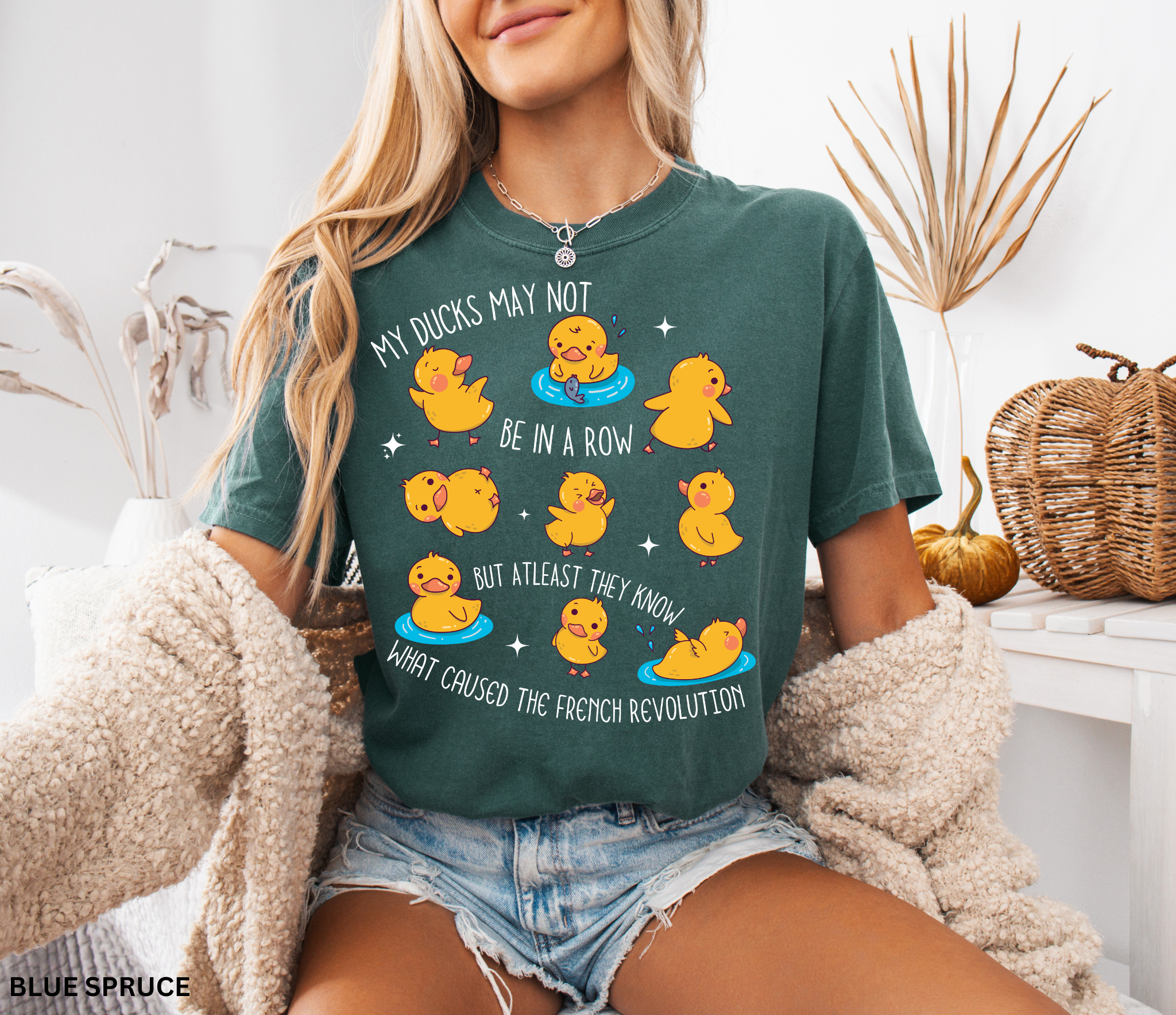 playful yellow ducks and the phrase “My ducks may not be in a row, but at least they know what caused the French Revolution.” Funny gift for history and social studies teachers.